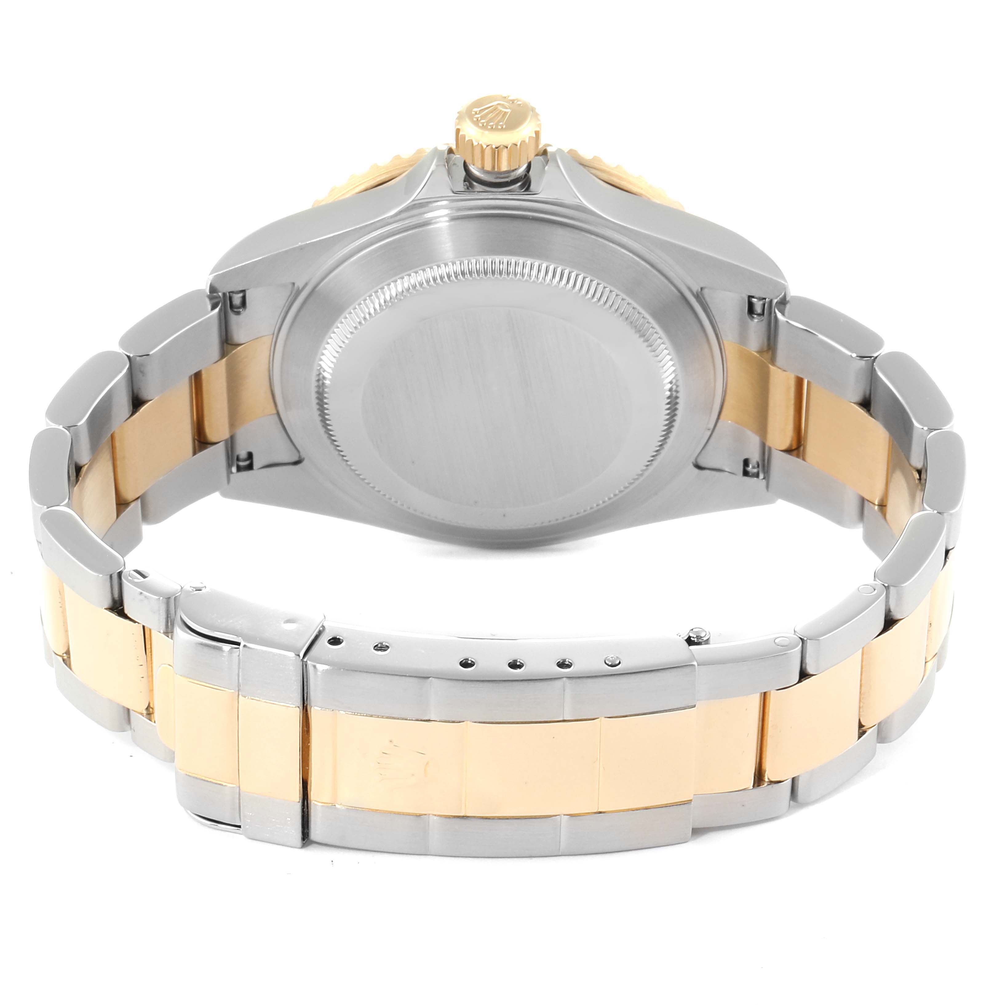 The image shows the back case, crown, and two-tone bracelet of a Rolex Submariner 16613 Men
s Steel and Gold (two tone) Blue Dial 16613 Men
s Steel and Gold (two tone) Blue Dial watch.