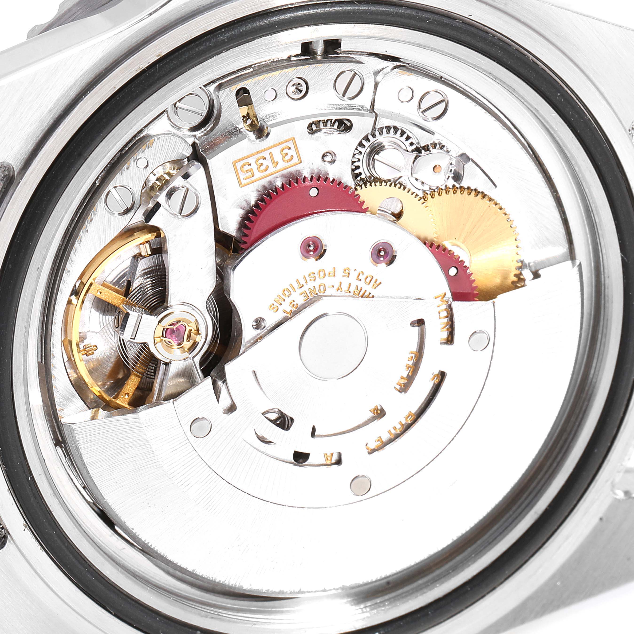 This image shows a close-up of the watch movement from the back of a Rolex Submariner 16610 Men's Stainless Steel Black Dial 16610 Men's Stainless Steel Black Dial model.