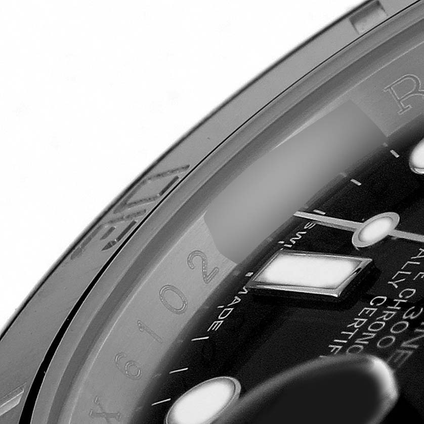 The image shows a close-up of the Rolex Submariner 116610 Men's Stainless Steel Black Dial's dial, with part of the rehaut and hour markers visible.
