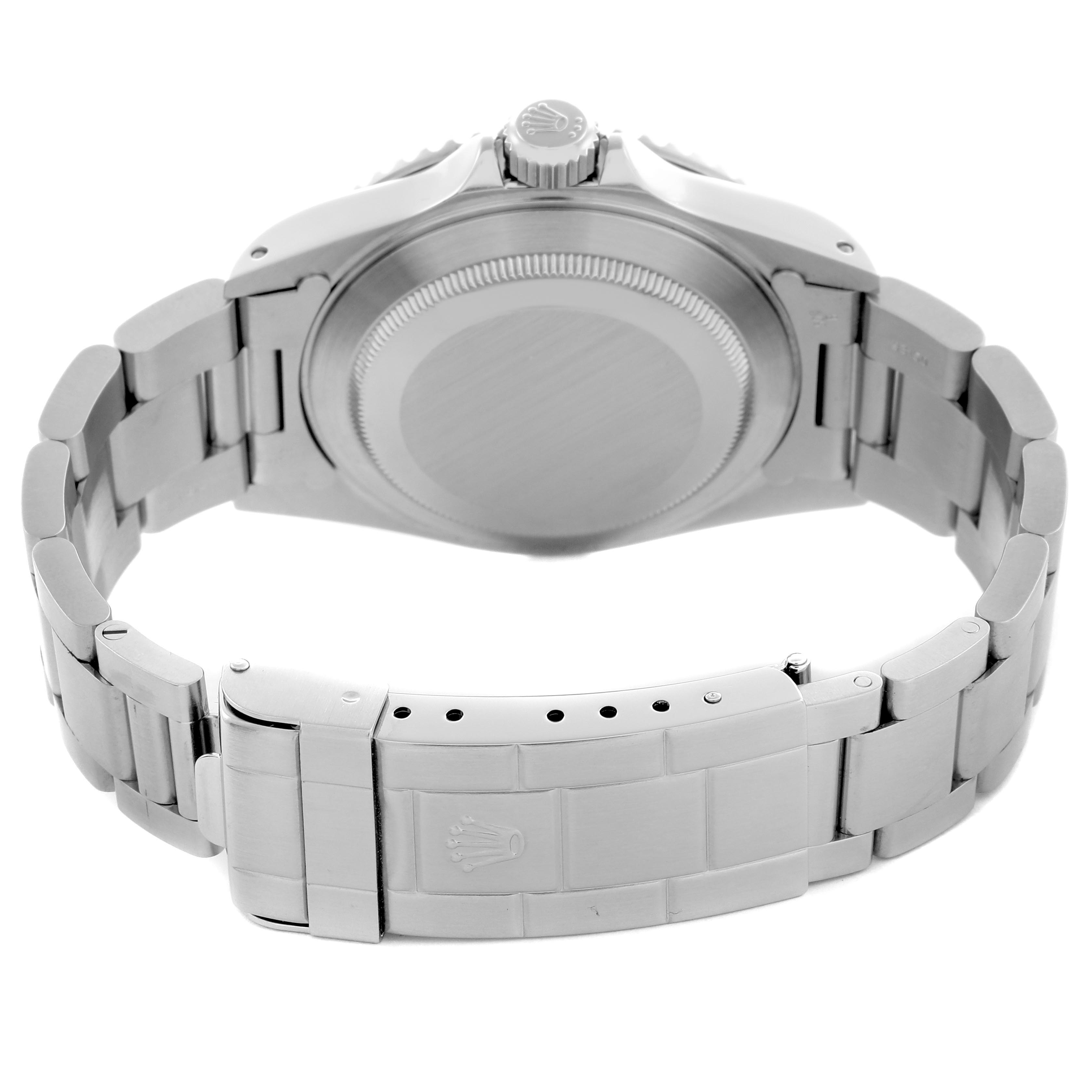 The image shows the back view of a Rolex Submariner 14060M Men
s Stainless Steel Black Dial 14060M Men
s Stainless Steel Black Dial, focusing on the caseback and bracelet with the clasp visible.