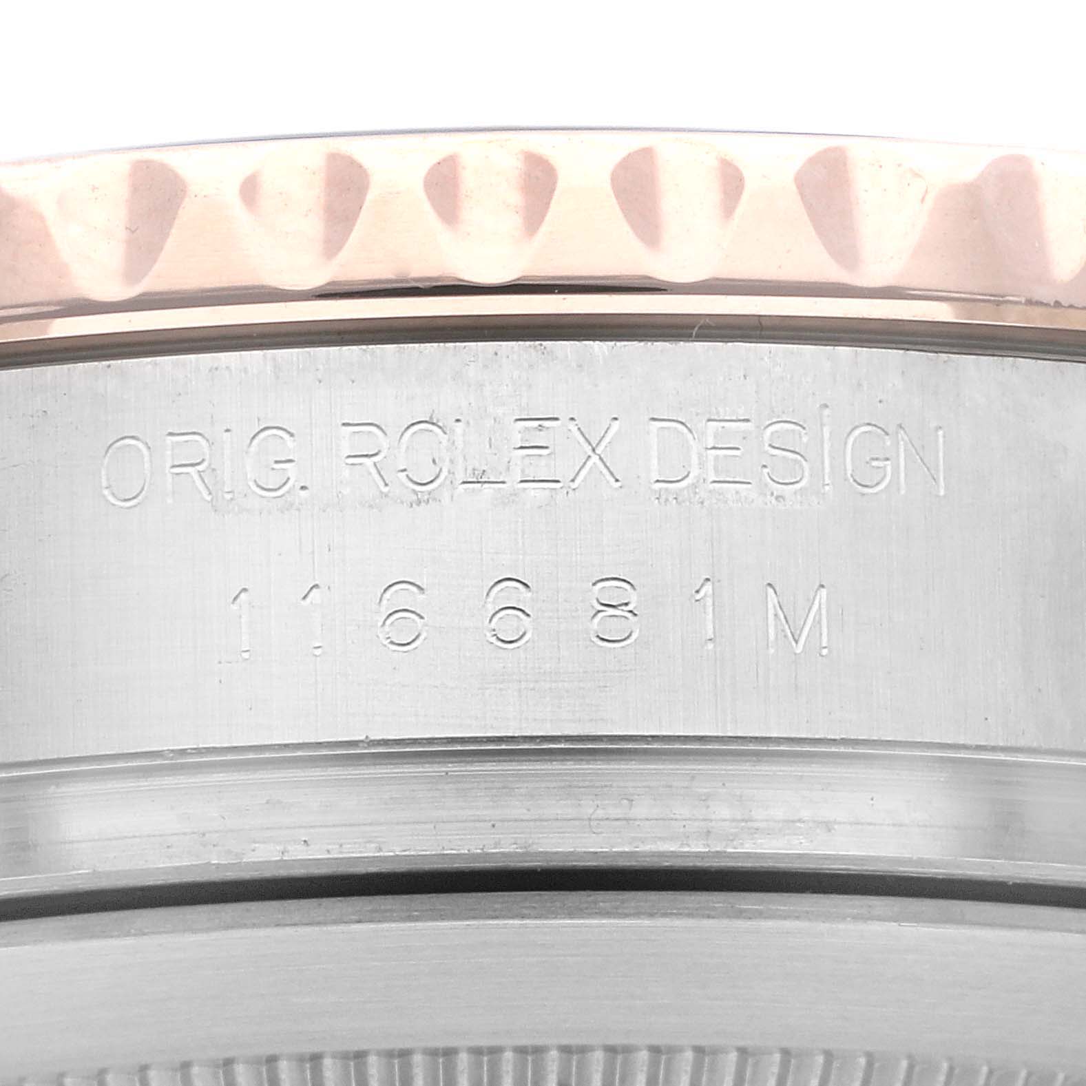This image shows a close-up of a Rolex Yacht-Master 116681 Men's Steel and Gold (two tone) White Dial 116681 Men's Steel and Gold (two tone) White Dial's case side, highlighting the model number 116681 M and "ORIG. ROLEX DESIGN" engraving.