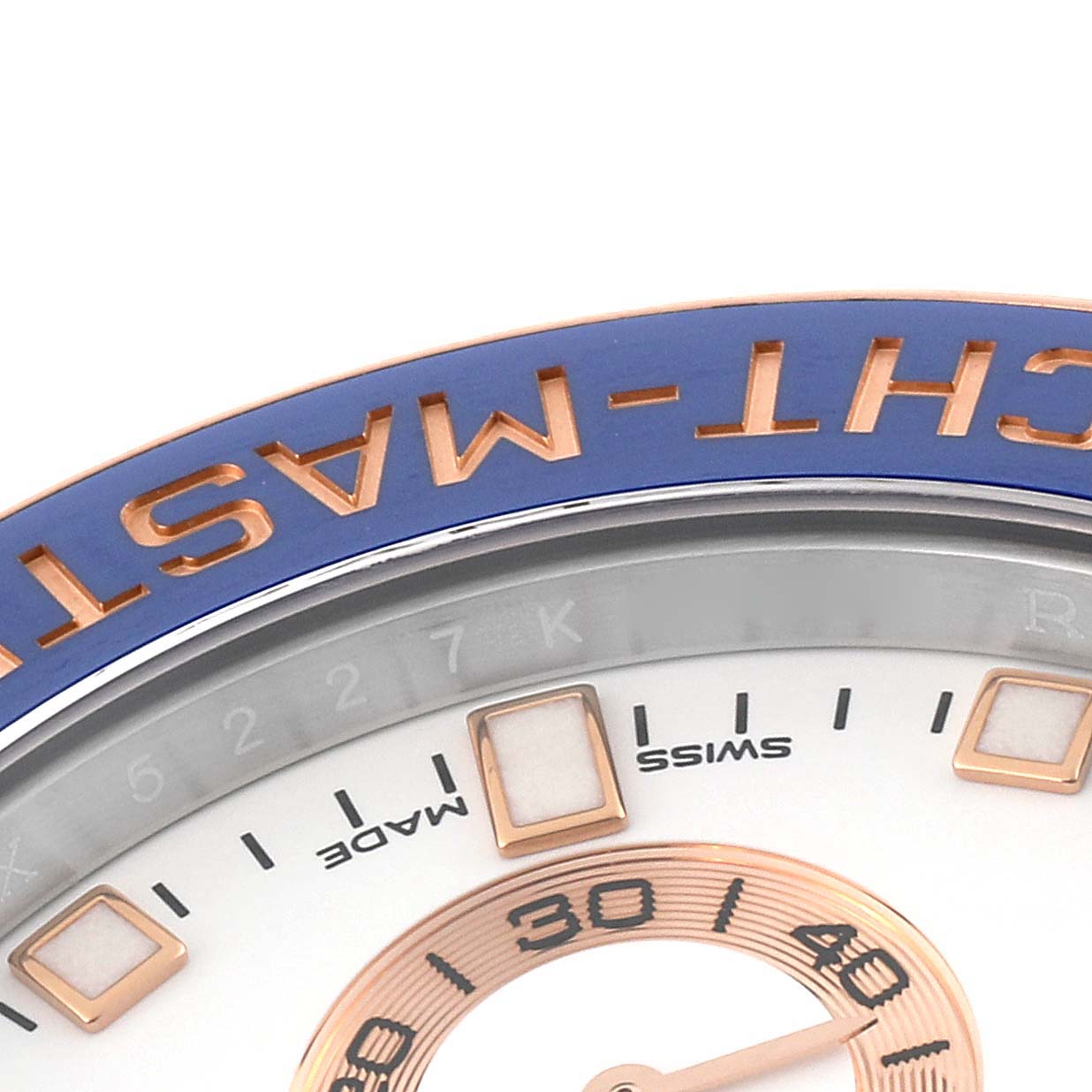 The image shows a close-up angle of the dial and bezel of a Rolex Yacht-Master 116681 Men's Steel and Gold (two tone) White Dial 116681 Men's Steel and Gold (two tone) White Dial watch, highlighting the "YACHT-MASTER" text in blue and gold.