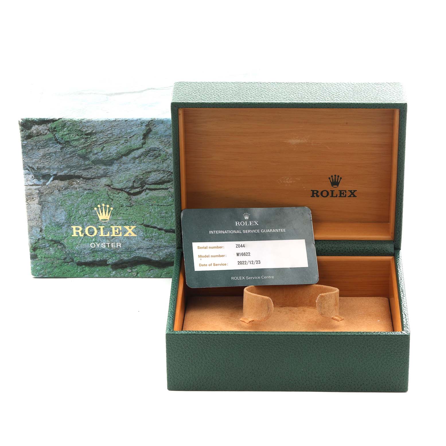 The image shows a Rolex Yacht-Master 16622 Men
s Stainless Steel Silver Dial 16622 Men
s Stainless Steel Silver Dial box and international service guarantee card from a front angle.