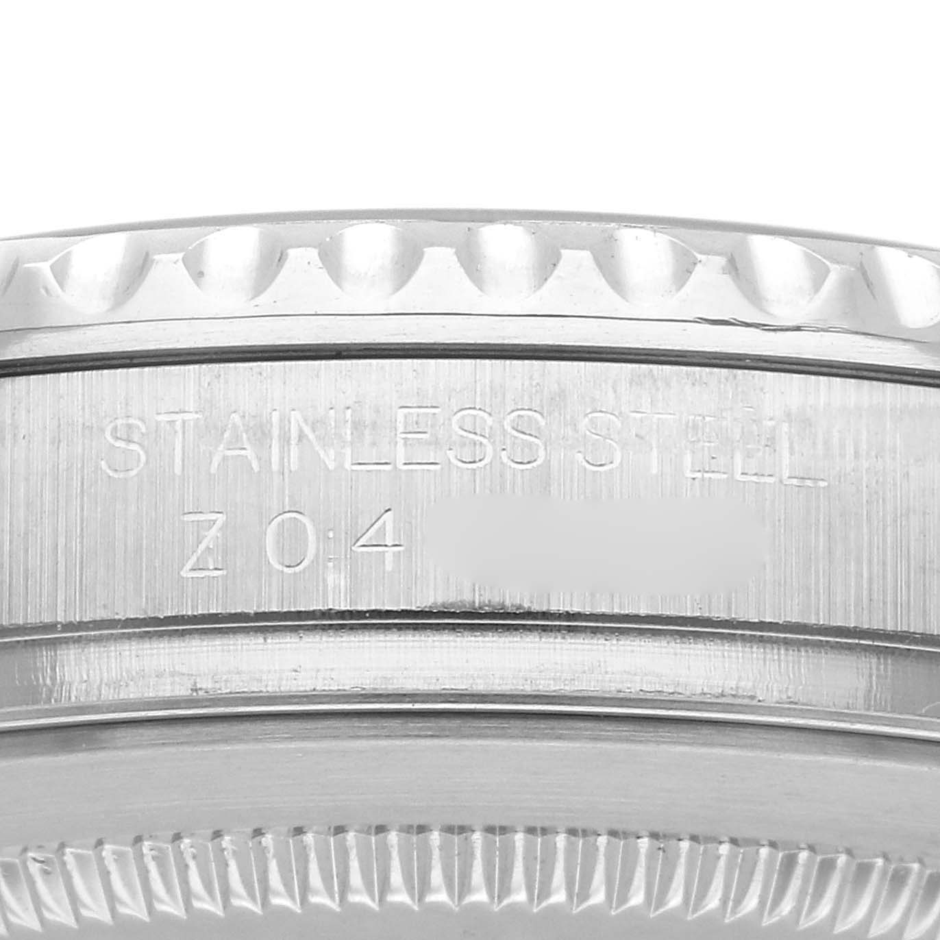 The image shows a side view of the Rolex Yacht-Master 16622 Men
s Stainless Steel Silver Dial 16622 Men
s Stainless Steel Silver Dial watch, focusing on the engraved stainless steel bezel edge.