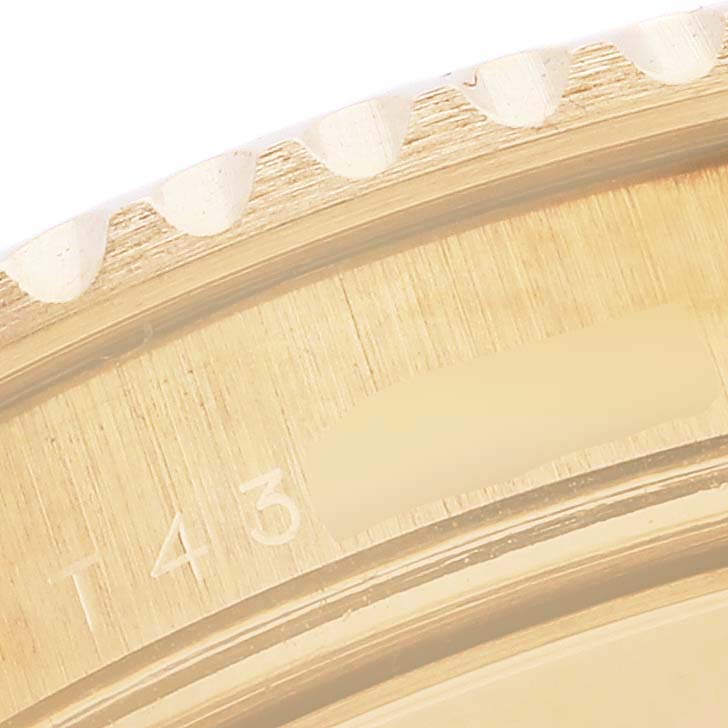 The image shows a close-up angle of the bezel and part of the case of a Rolex Yacht-Master 16628 Men's Yellow Gold Mother of Pearl Dial 16628 Men's Yellow Gold Mother of Pearl Dial watch.