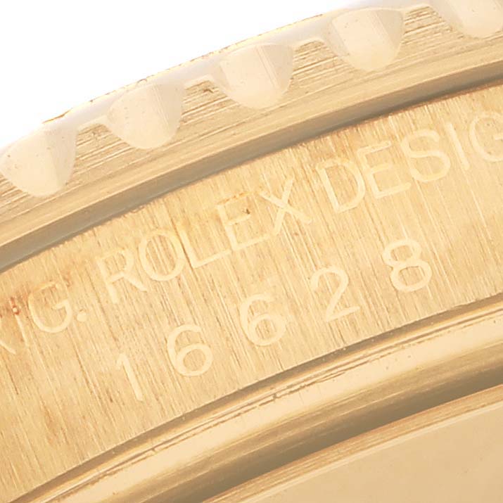 This close-up image shows the engraved text on the bezel and case of a Yacht-Master model by Rolex.