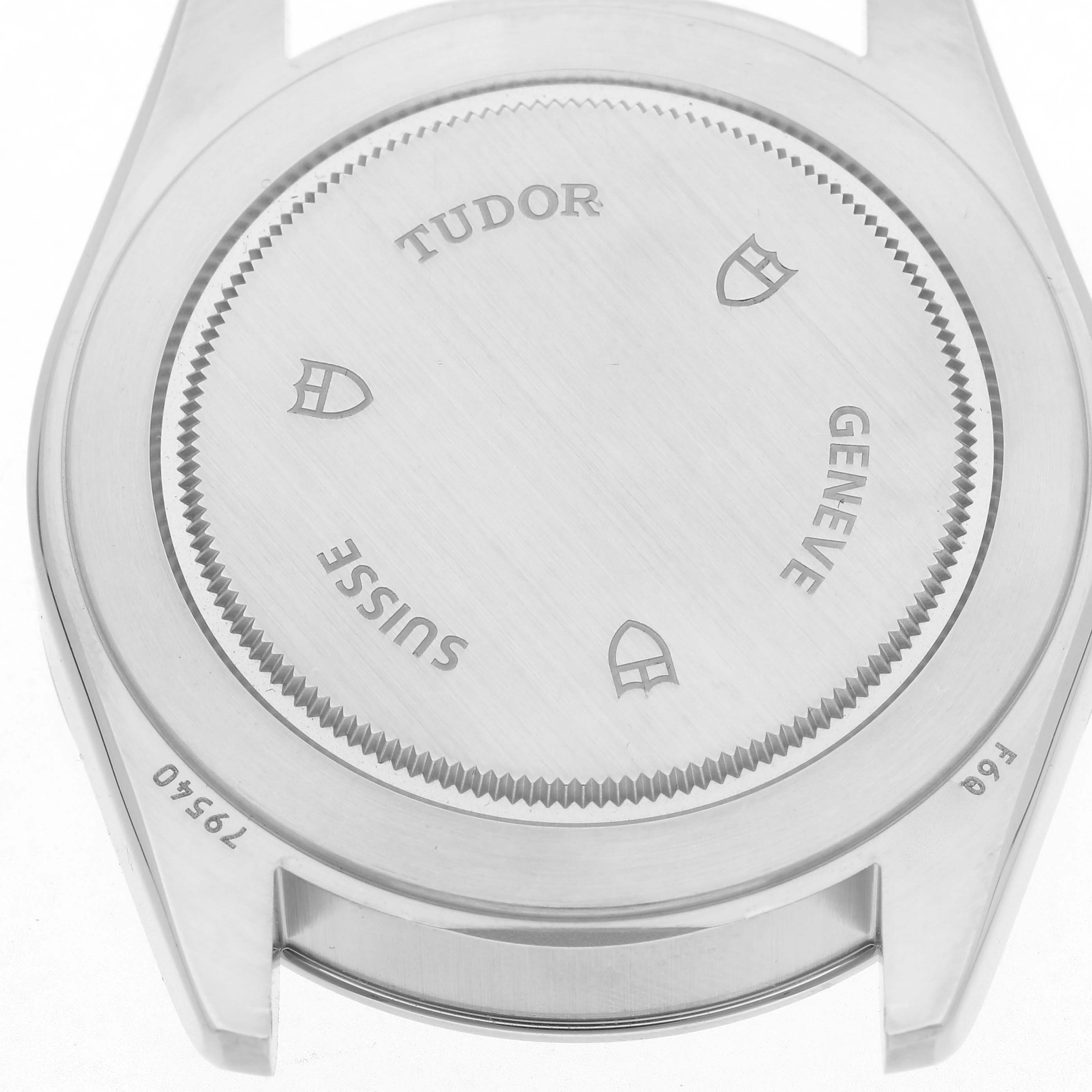 The image shows the case back of a Tudor Heritage Black Bay 79540 Men
s Stainless Steel Blue Dial 79540 Men
s Stainless Steel Blue Dial watch, emphasizing engraved branding.