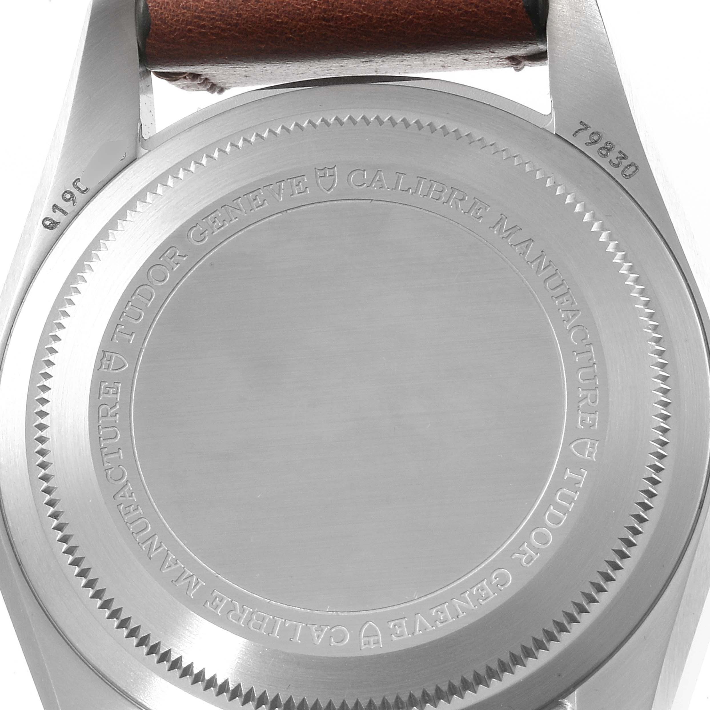 The image shows the back case of a Tudor Heritage Black Bay 79830RB Men
s Stainless Steel Black Dial 79830RB Men
s Stainless Steel Black Dial watch, highlighting the engraved details and model number.