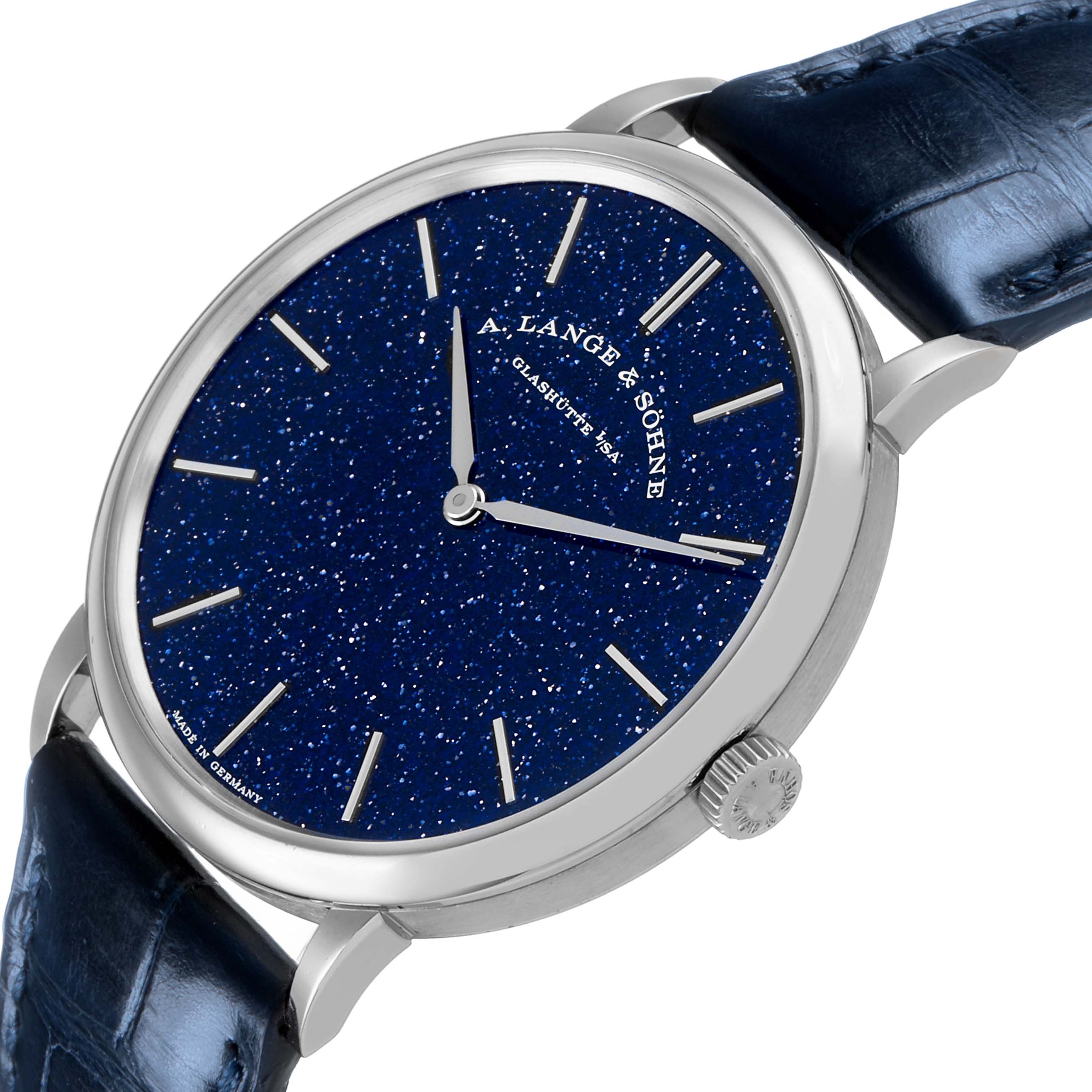 The A. Lange & Sohne Saxonia 205.086 Men's White Gold Blue Dial watch is shown from a front angle, highlighting its blue starry dial, silver hands, and crown.