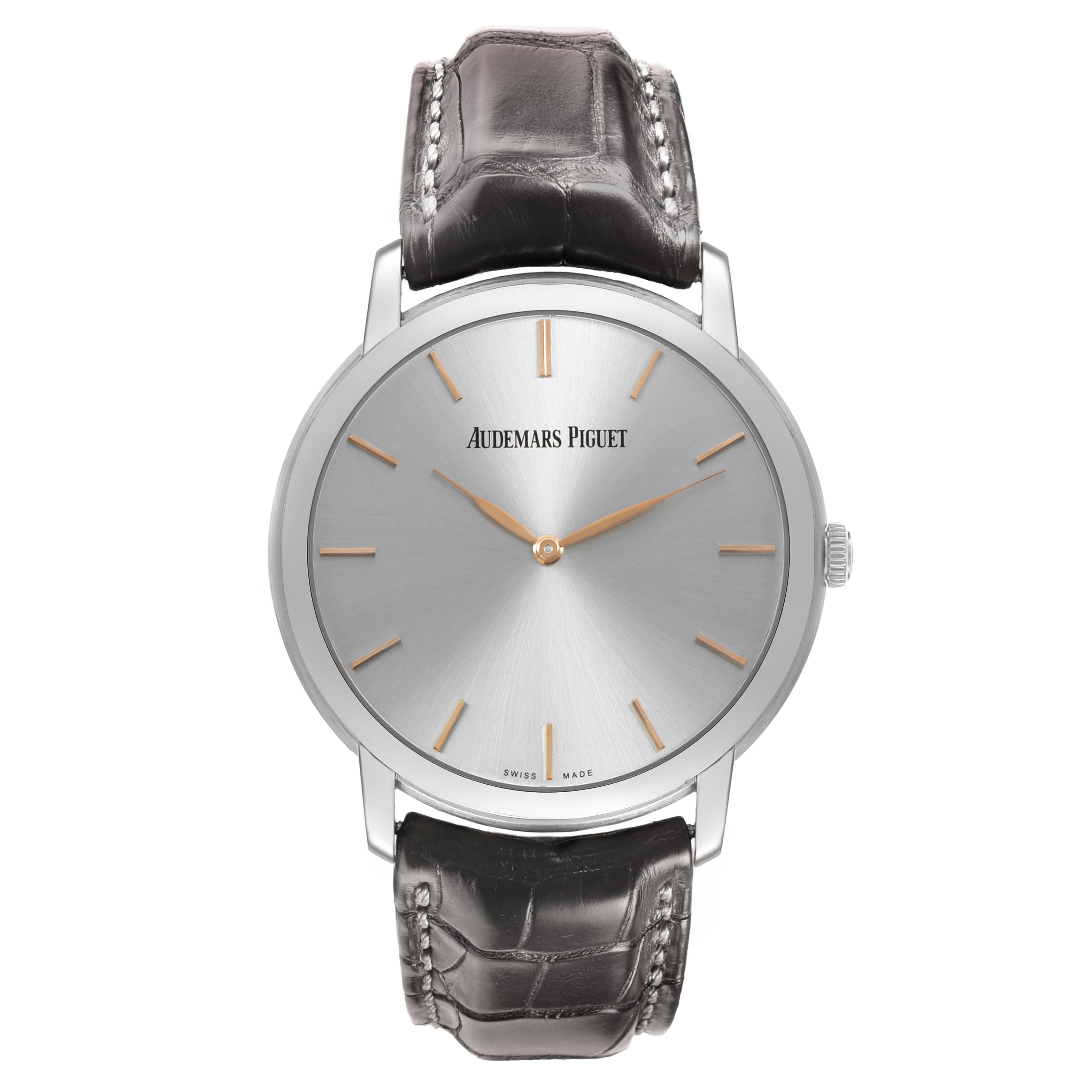 The image shows a front view of the Audemars Piguet Jules 15180BC Men's White Gold Silver Dial watch, featuring a leather strap and simple markers.
