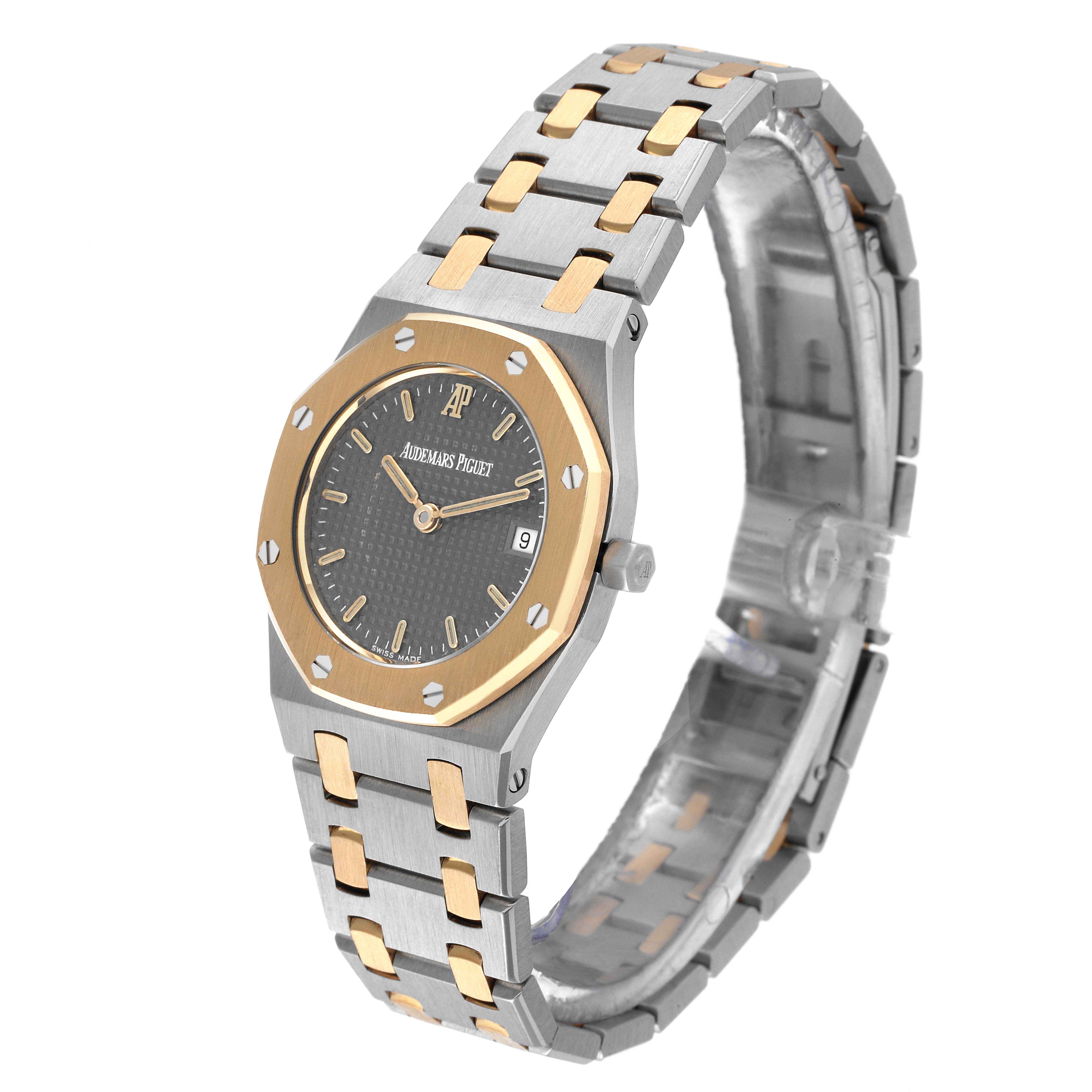 This is an angled view of an Audemars Piguet Royal Oak Women's Steel and Gold (two tone) Grey Dial Women's Steel and Gold (two tone) Grey Dial watch, showing the watch face, bezel, crown, and bracelet.