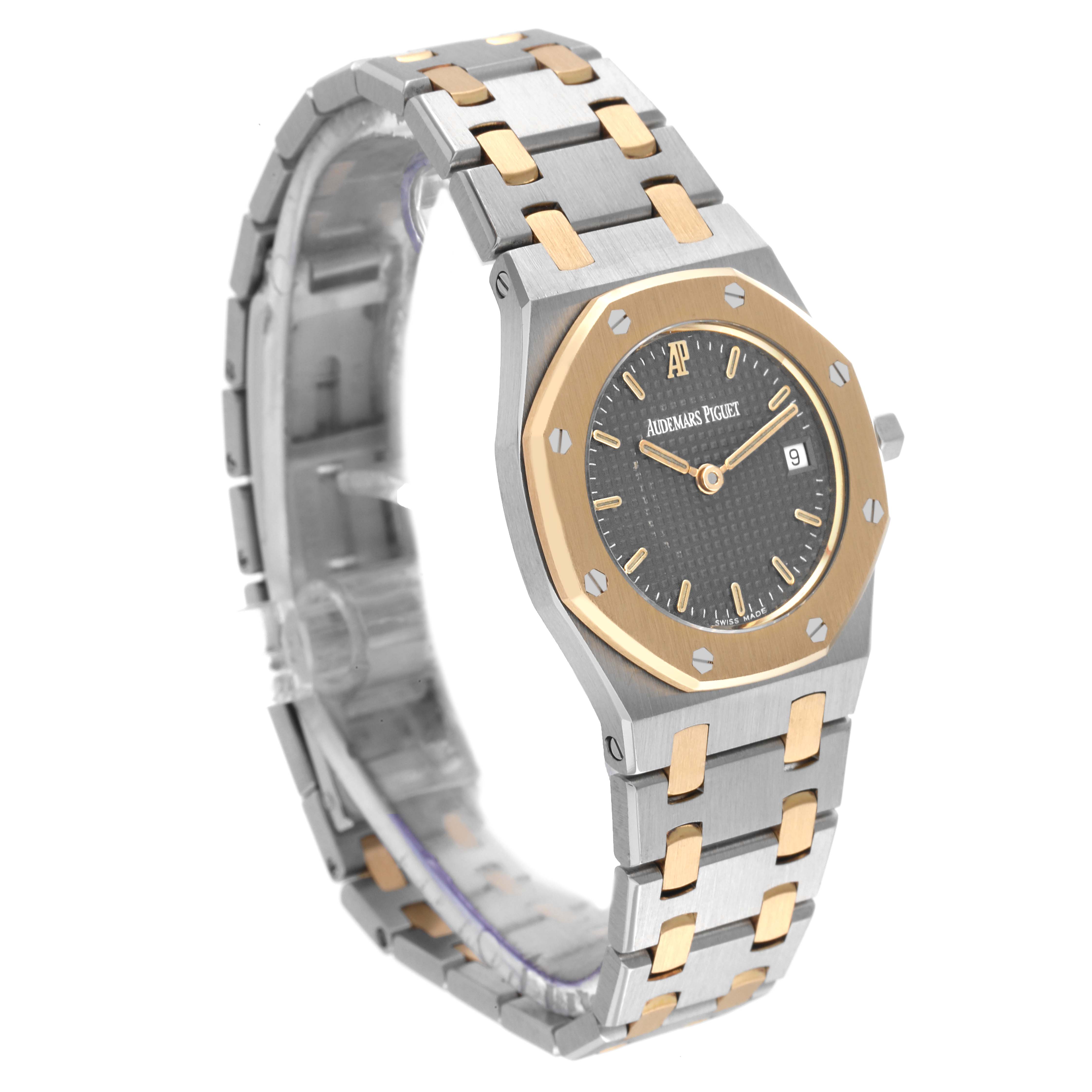 This image shows a Royal Oak model watch by Audemars Piguet at an angle highlighting the face, bezel, and bracelet.
