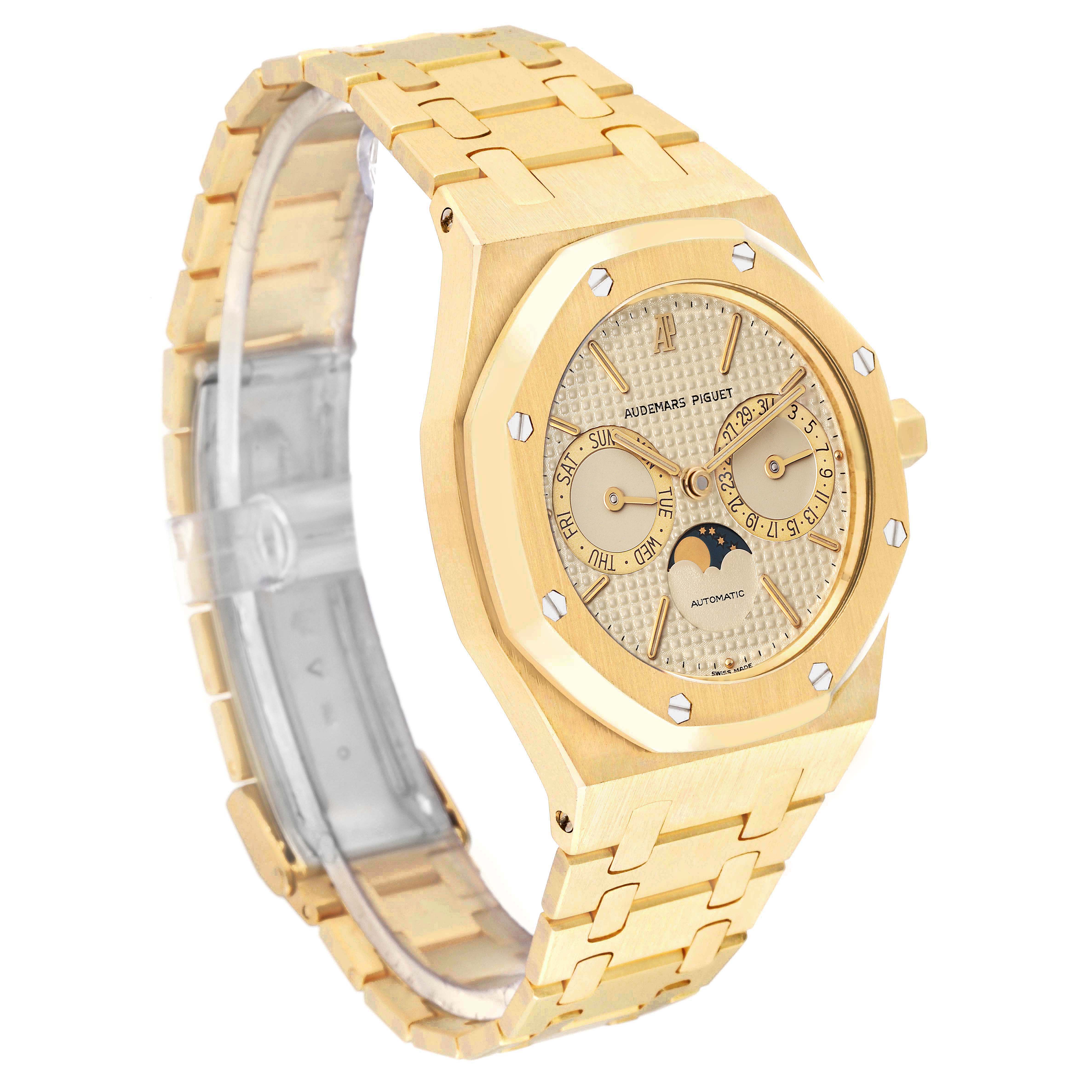 The Audemars Piguet Royal Oak 25594BA Men's Yellow Gold Champagne Dial is shown at a three-quarter angle, highlighting the case, bracelet, and dial with a sub-dial and moon phase.