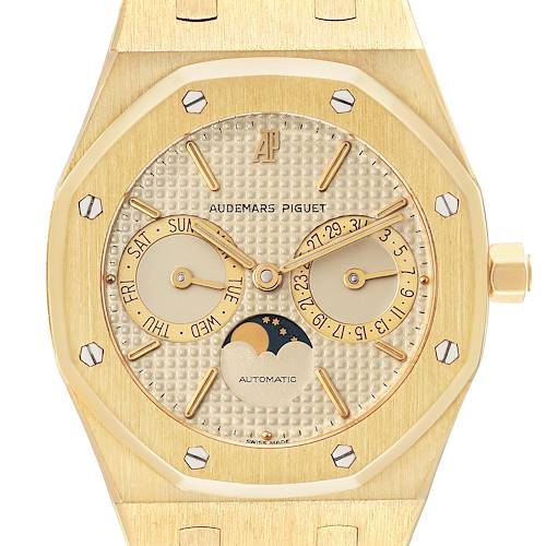 The Royal Oak by Audemars Piguet is shown from the front, featuring its dial with calendar subdials and a moon phase display.