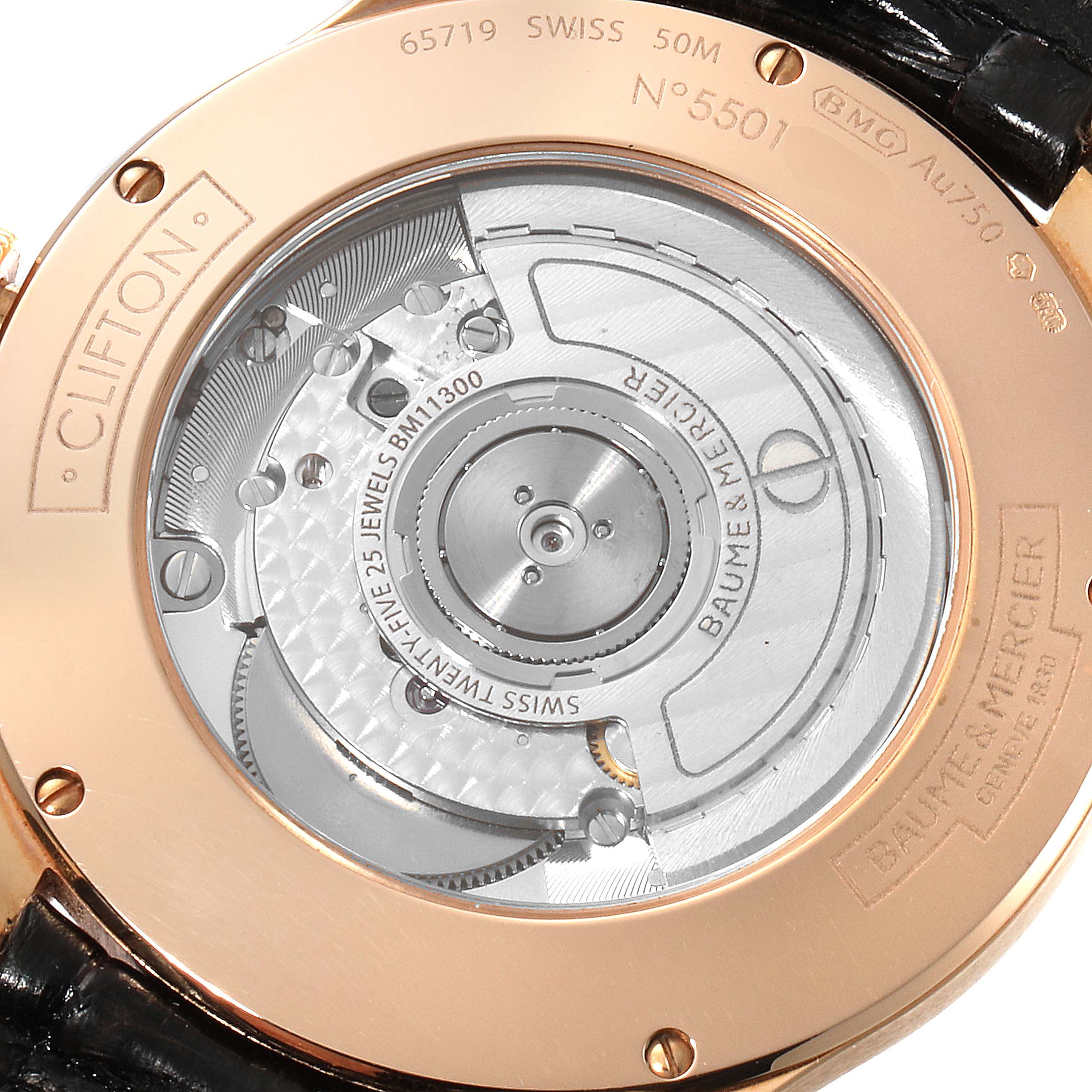 The image shows the back view of a Baume & Mercier Clifton M0A10059 Men's Rose Gold Grey Dial M0A10059 Men's Rose Gold Grey Dial watch, revealing its inner mechanical components.