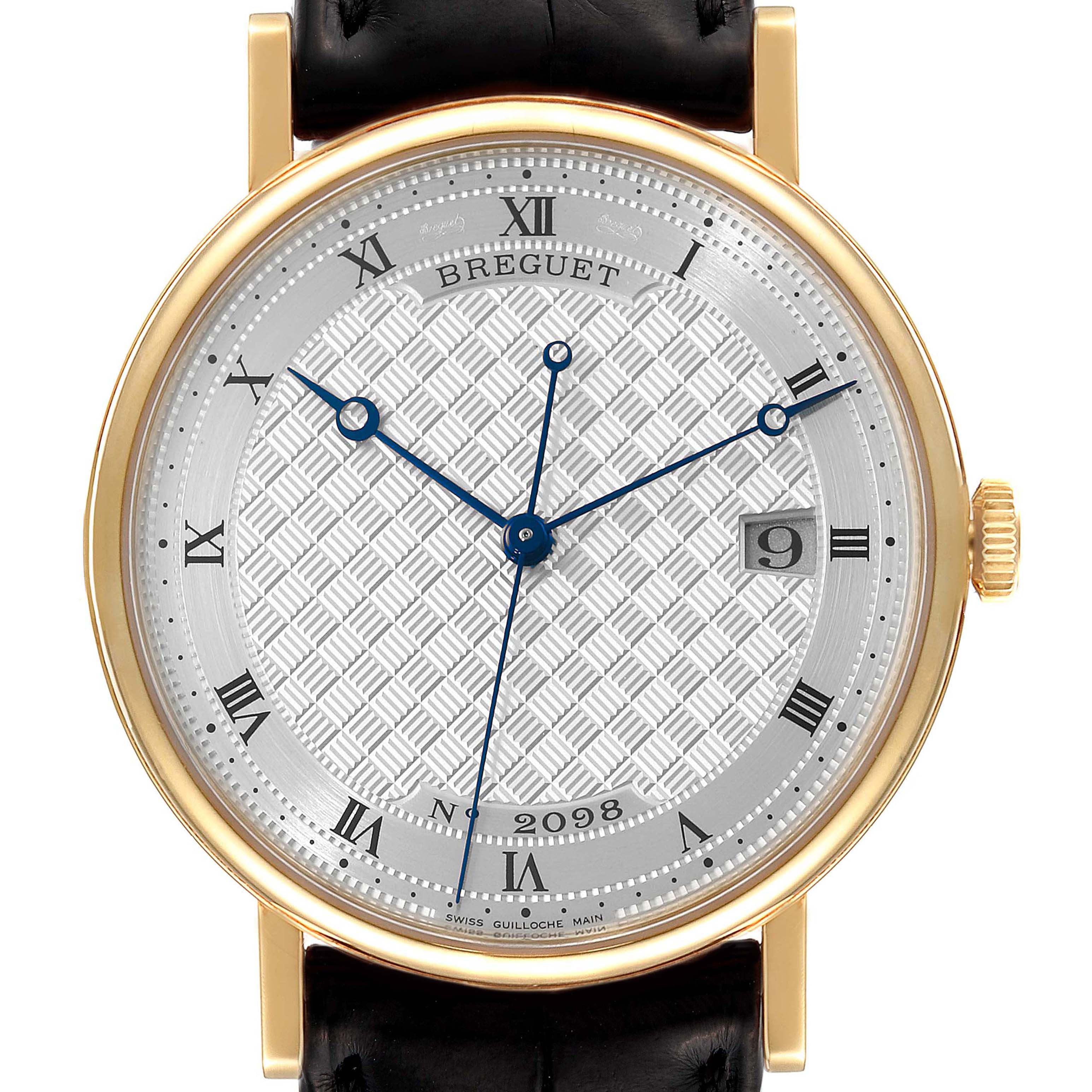 The image shows a frontal view of the Breguet Classique 5177BA/12/9V6 Men's Yellow Gold Silver Dial 5177BA/12/9V6 Men's Yellow Gold Silver Dial watch, highlighting its dial, hands, crown, and strap attachments.