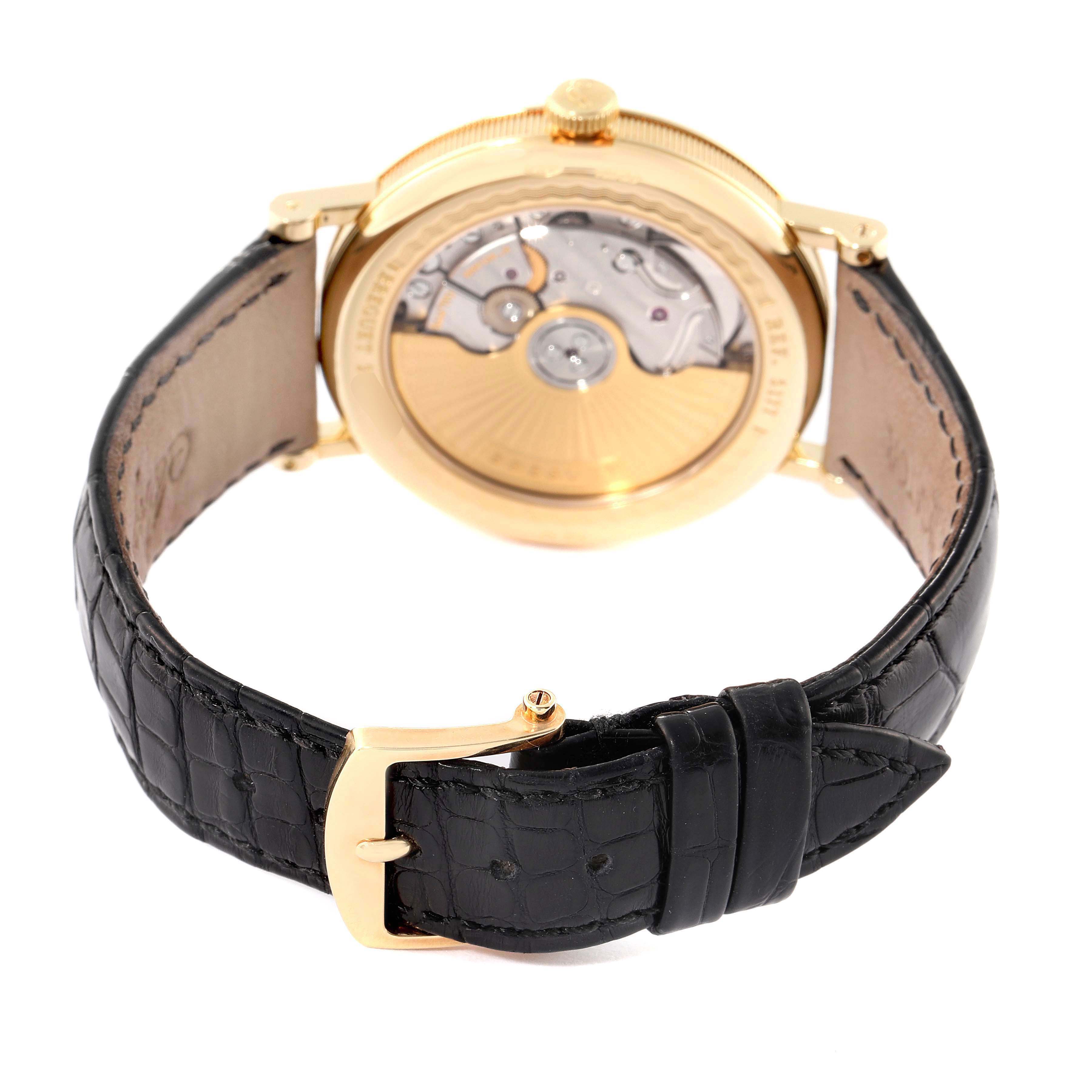 The image shows the back view of a Breguet Classique 5177BA/12/9V6 Men's Yellow Gold Silver Dial 5177BA/12/9V6 Men's Yellow Gold Silver Dial watch, highlighting its movement and leather strap.