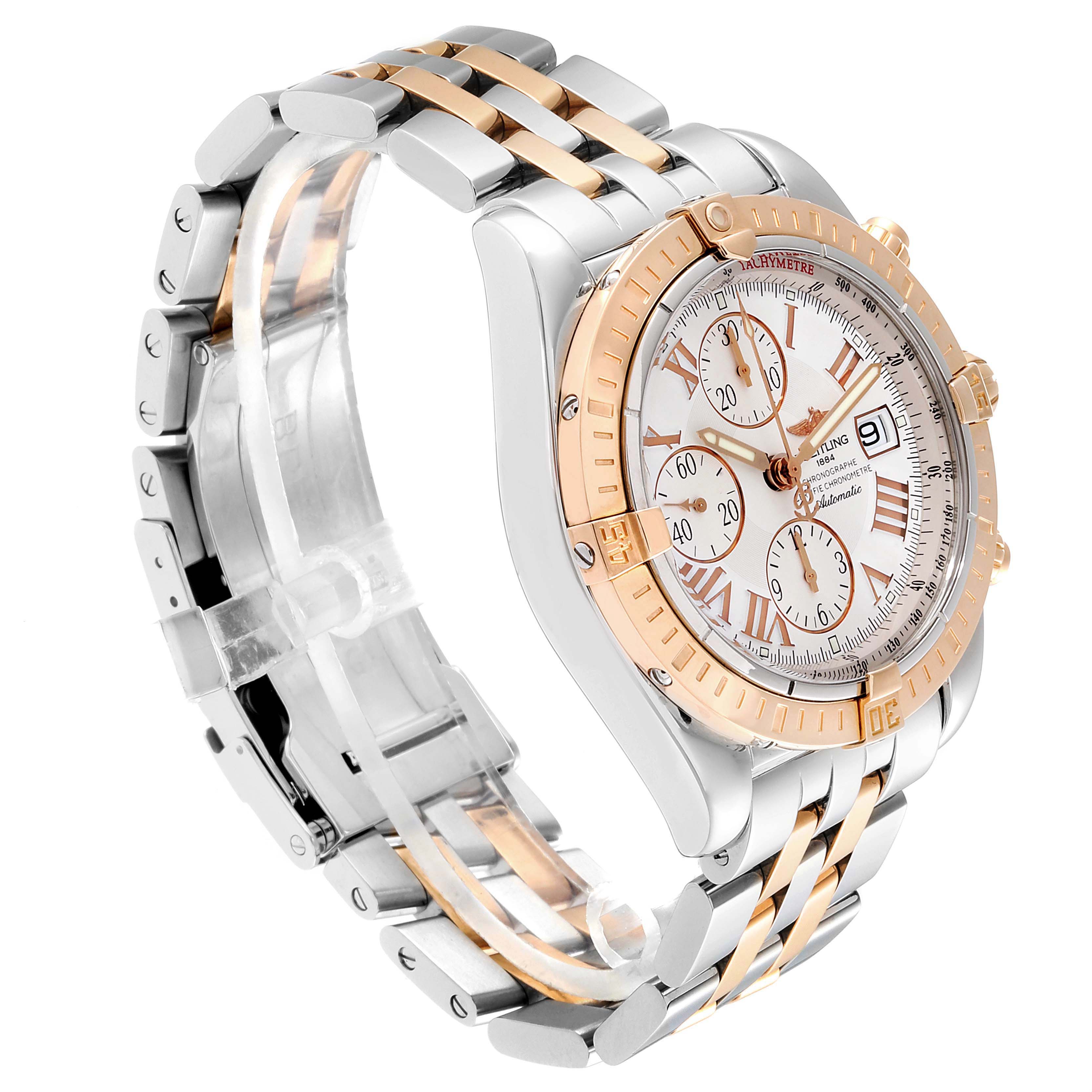 The image shows a Breitling Chronomat C13356 Men's Steel and Gold (two tone) White Dial C13356 Men's Steel and Gold (two tone) White Dial watch from a front-side angle, highlighting its bezel, dial, and bracelet.
