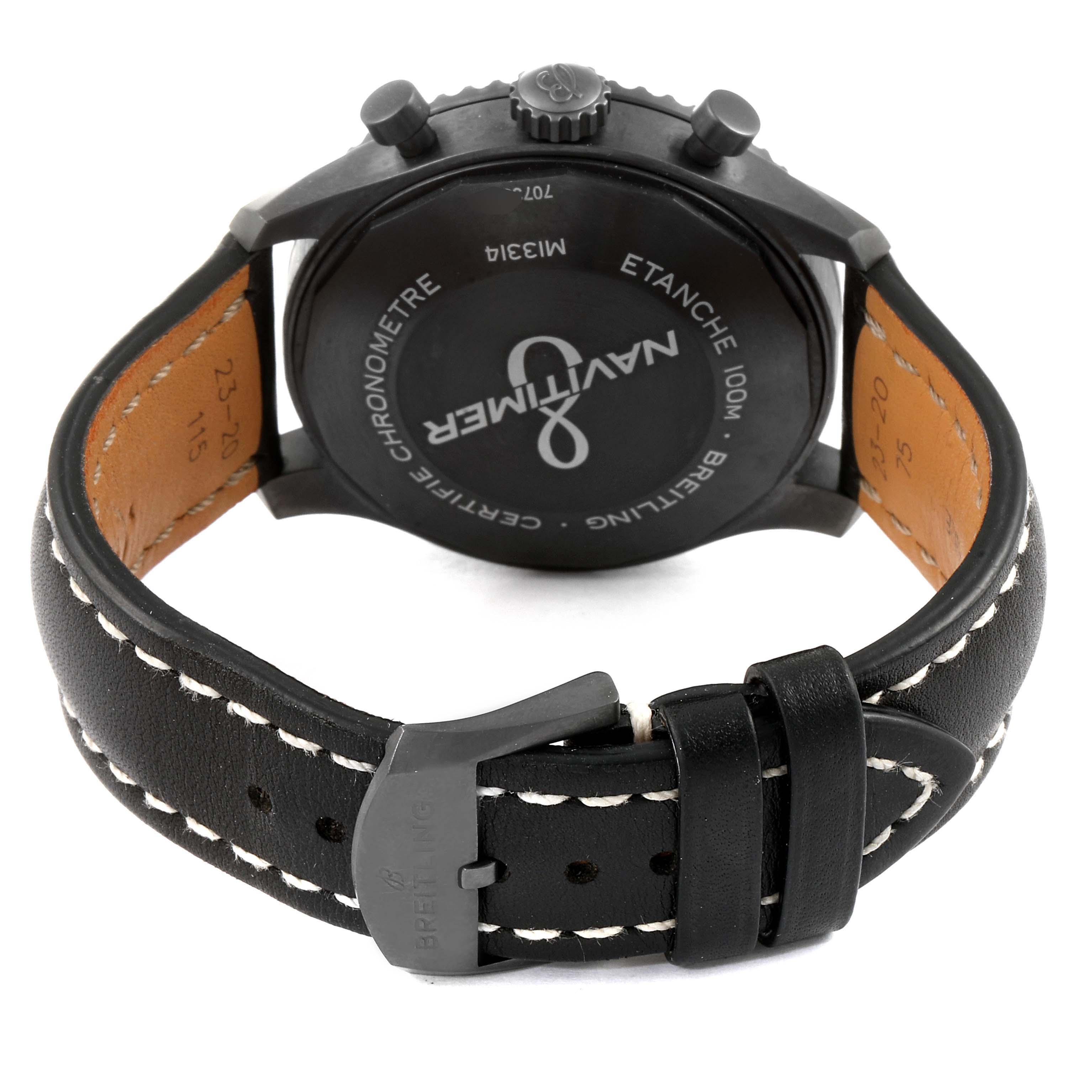 The image shows the back view of a Breitling Navitimer M13314101B1X1 Men
s Stainless Steel Black Dial M13314101B1X1 Men
s Stainless Steel Black Dial watch, highlighting the case back, crown, and leather strap with a buckle.