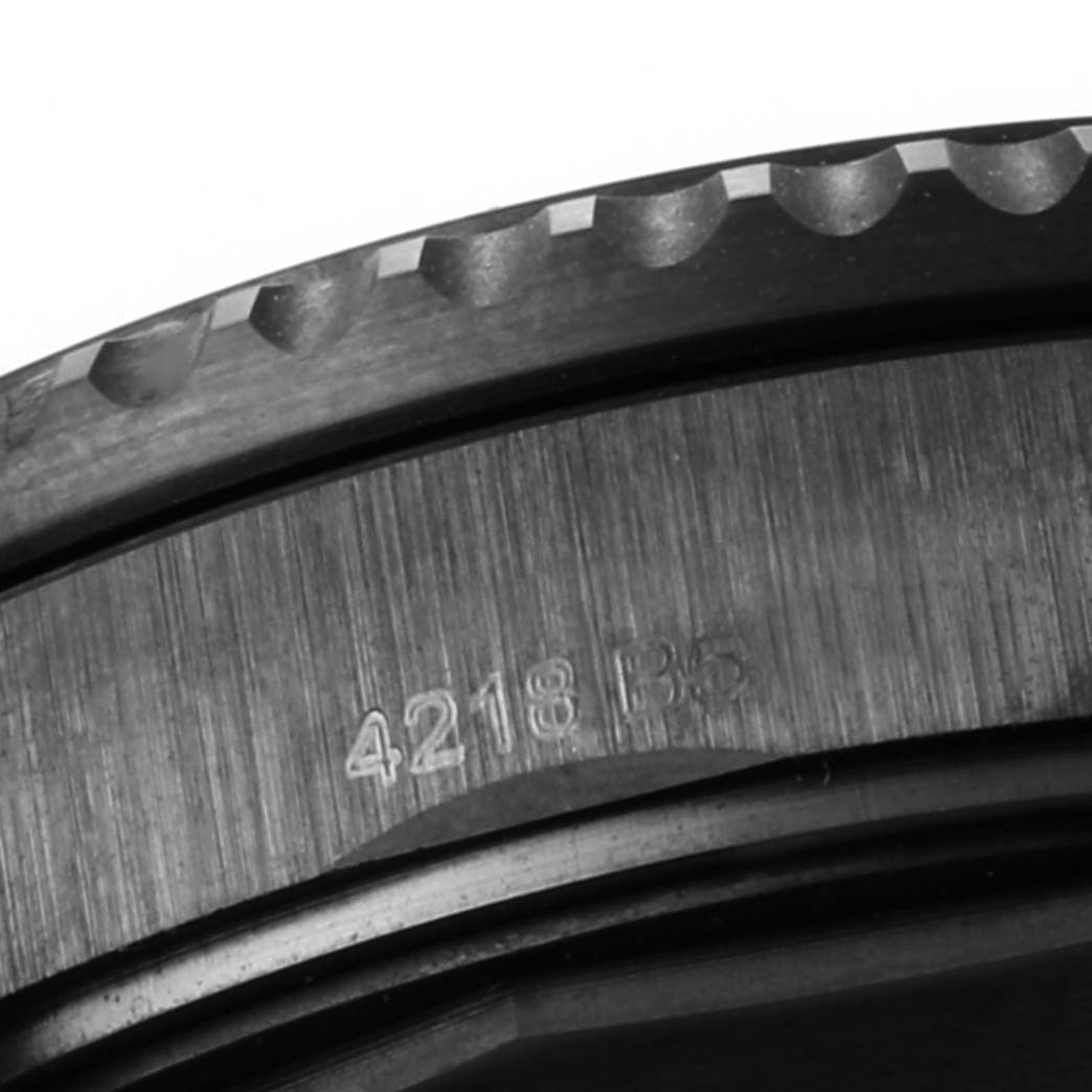 This close-up image of the Breitling Navitimer M13314101B1X1 Men
s Stainless Steel Black Dial M13314101B1X1 Men
s Stainless Steel Black Dial watch shows a detailed view of its bezel and part of the case with engraved numbers.