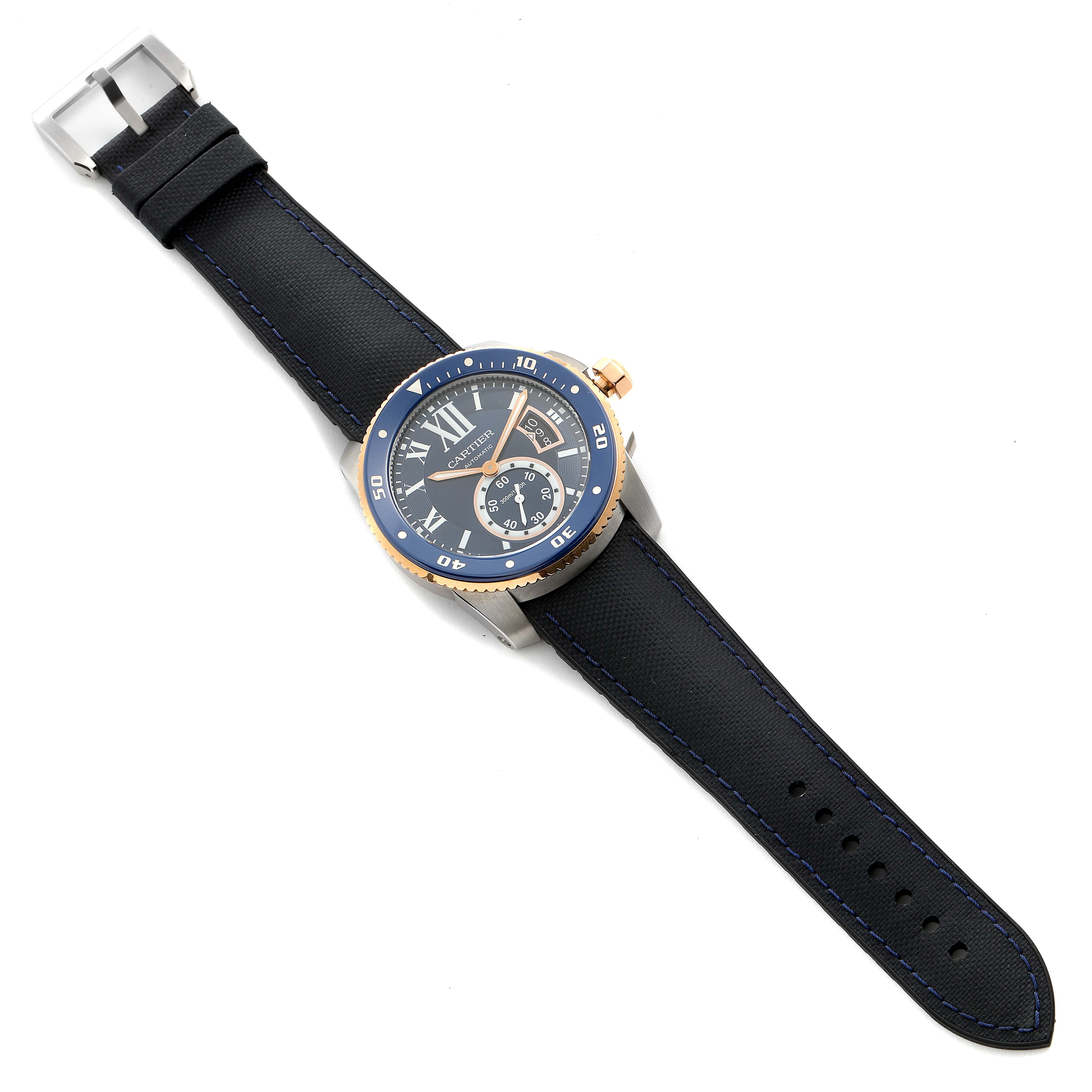 The image shows a top-down view of a Calibre de Cartier watch by Cartier, displaying the face, bezel, crown, and strap.