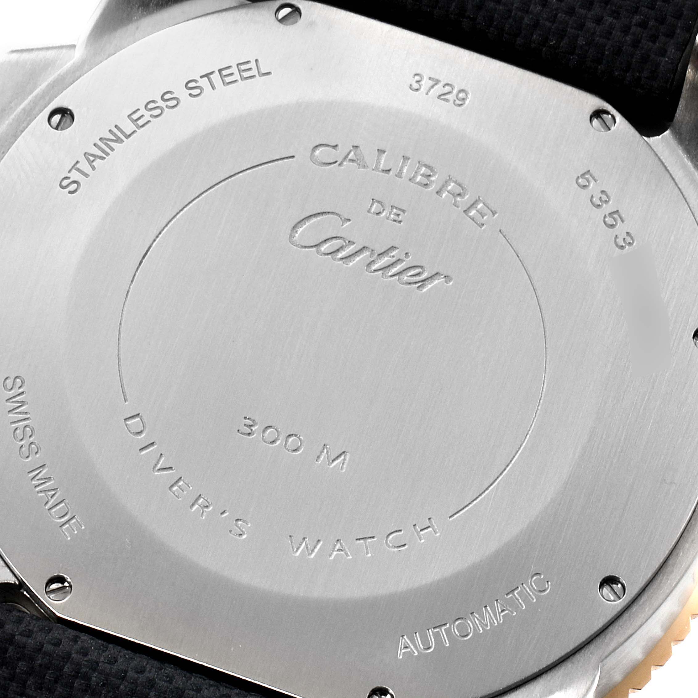 The image shows the stainless steel back case of a Calibre de Cartier watch by Cartier.