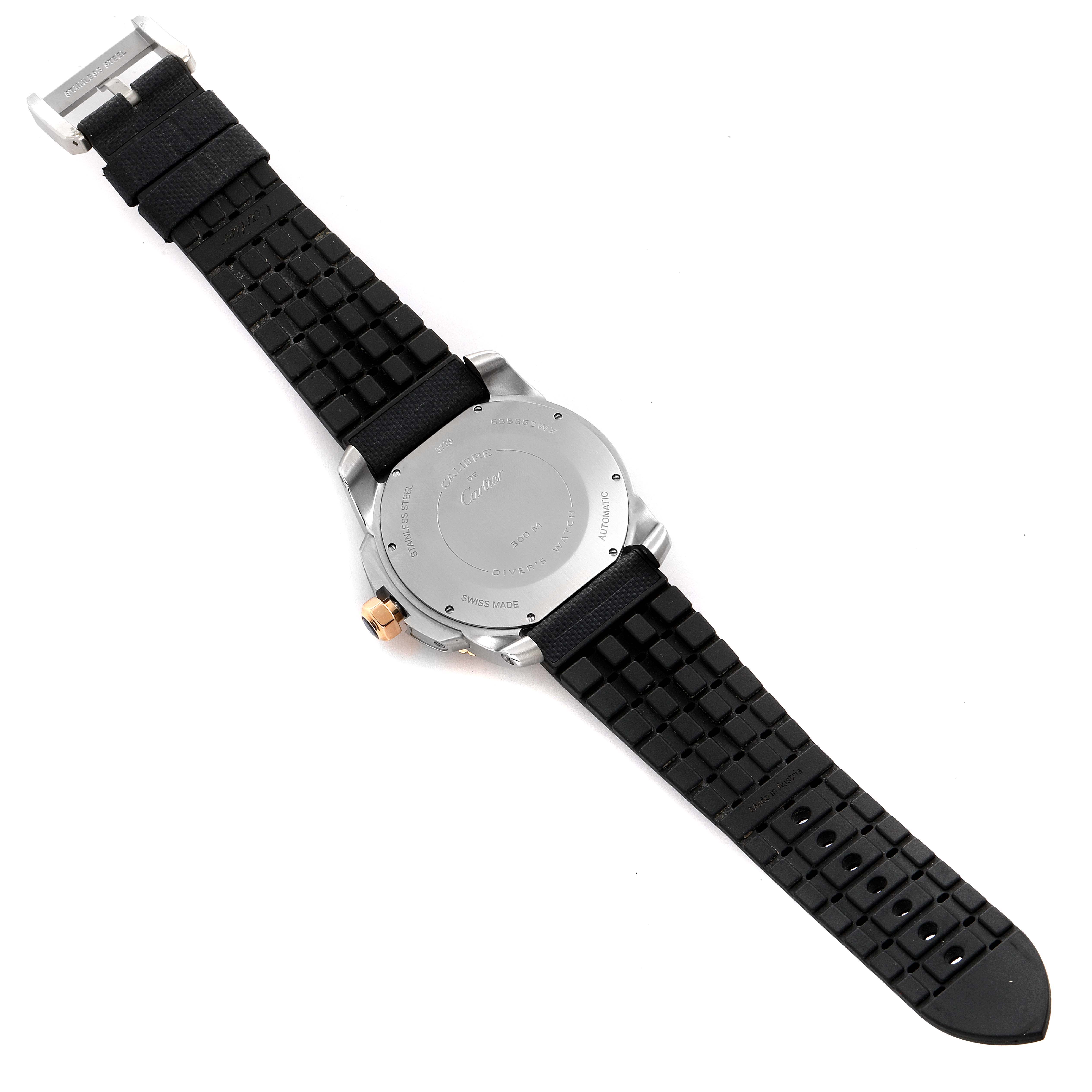 This is the back view of the Calibre de Cartier watch by Cartier, showing the case back and black rubber strap.