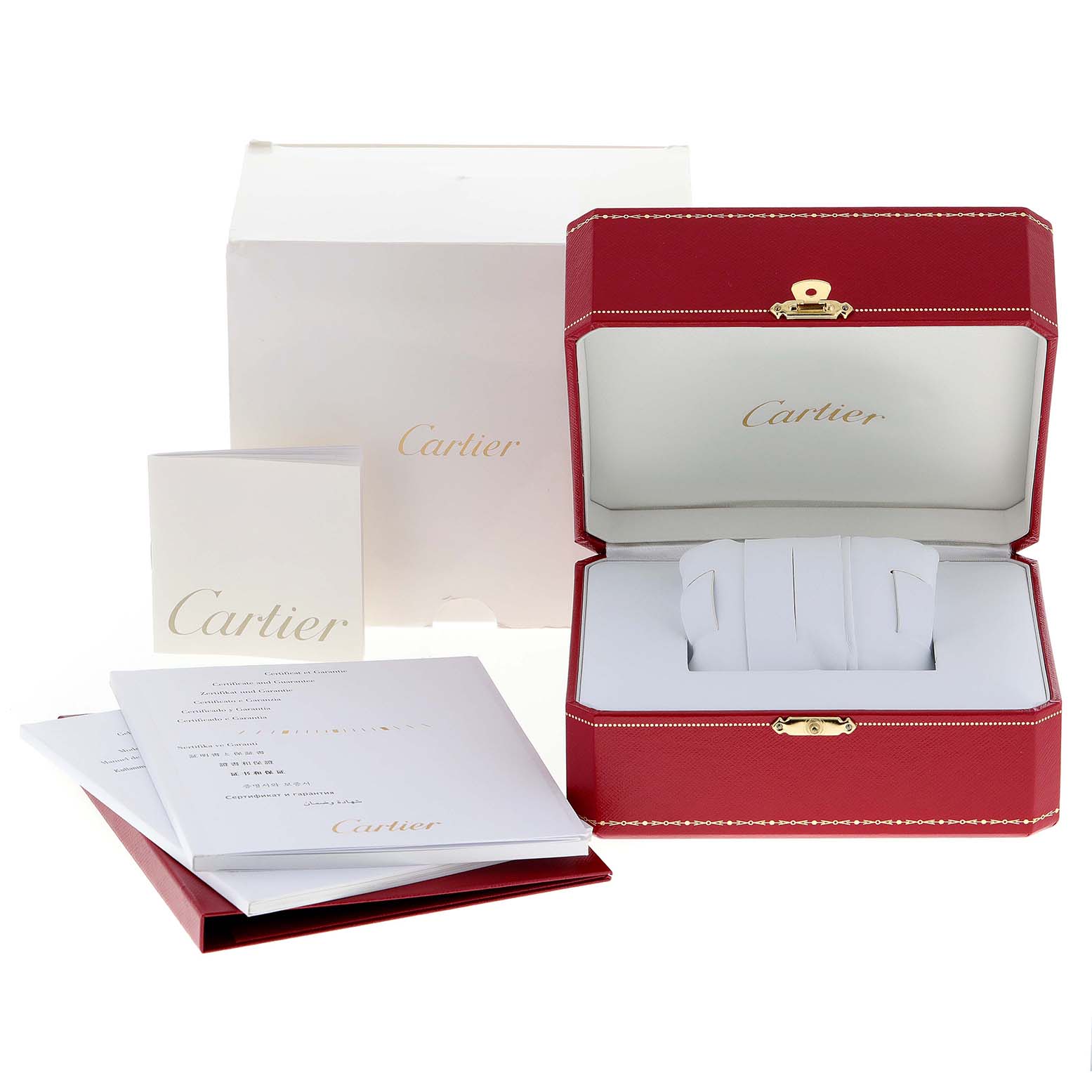 This image shows the packaging and accessories of the Calibre de Cartier watch by Cartier, including an open red box and documents.