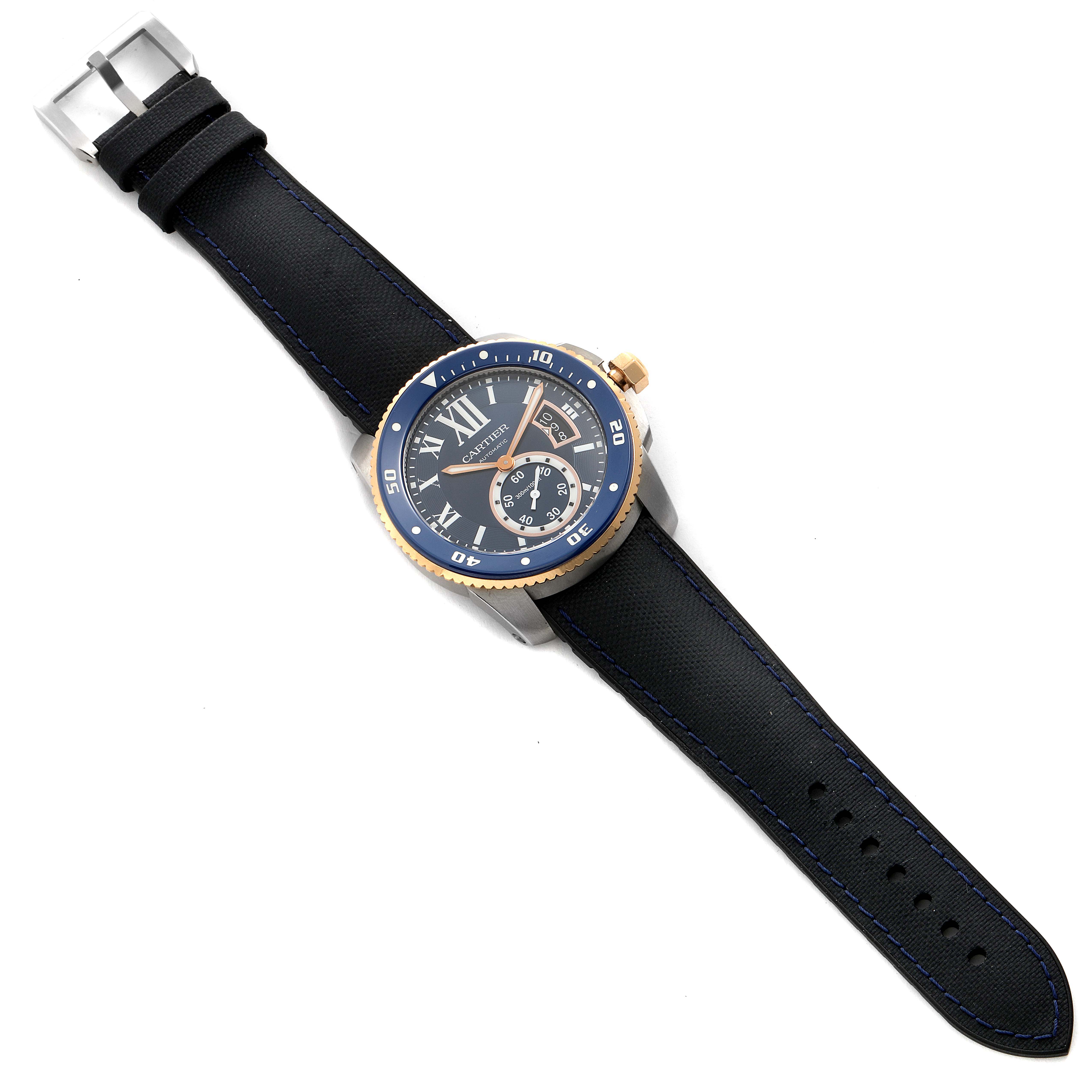 The image shows a top-down view of a Calibre de Cartier watch by Cartier, displaying the face, bezel, and strap.