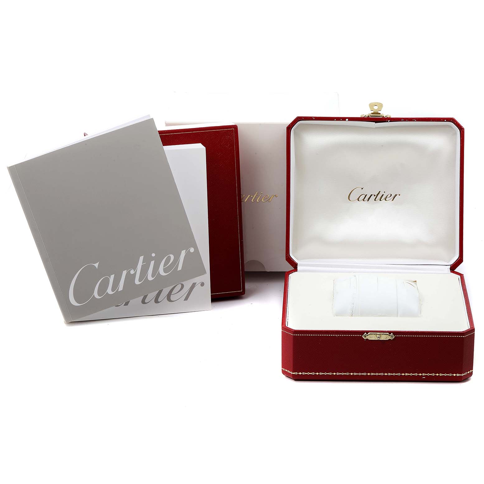 The image shows the presentation box and manuals for the Cartier Pasha W31075M7 Women's Stainless Steel Pink Dial W31075M7 Women's Stainless Steel Pink Dial watch, viewed from the front.