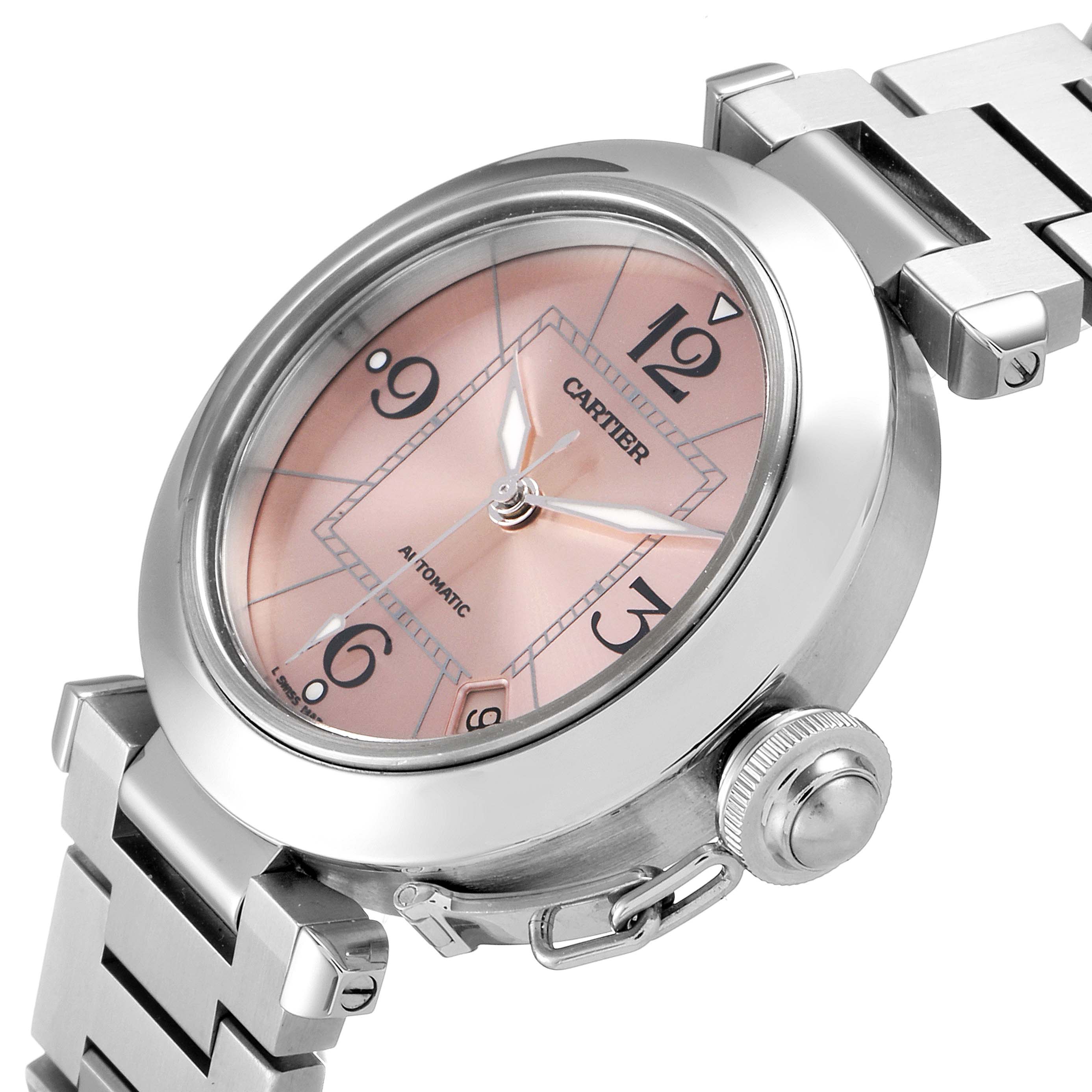 This image shows a side perspective of the Cartier Pasha W31075M7 Women's Stainless Steel Pink Dial W31075M7 Women's Stainless Steel Pink Dial watch, highlighting its dial, bezel, crown, and part of the bracelet.