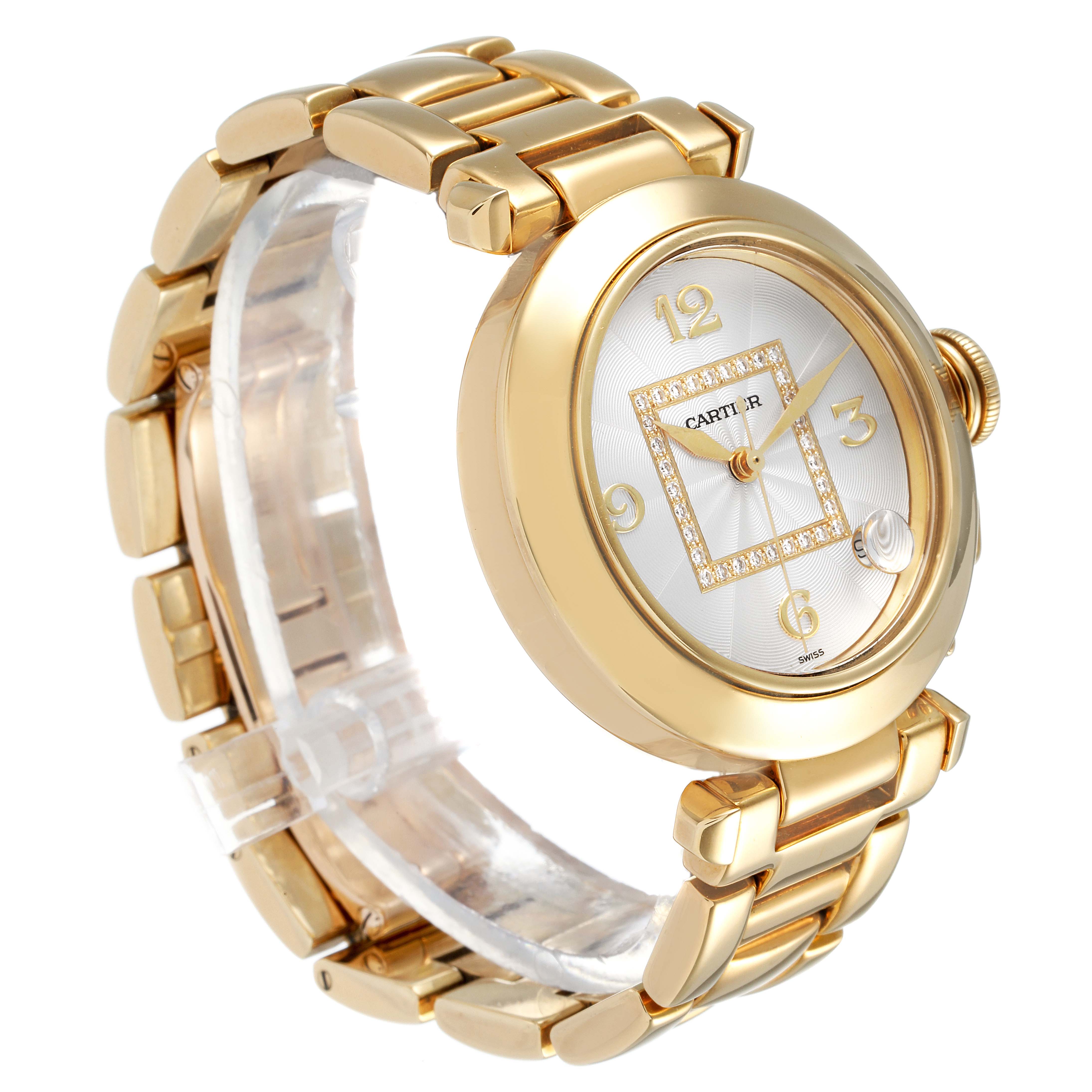 The image shows a three-quarter view of the Cartier Pasha WJ1110H9 Women's Yellow Gold Silver Dial WJ1110H9 Women's Yellow Gold Silver Dial watch, highlighting its gold case, bracelet, and face with diamond embellishments.