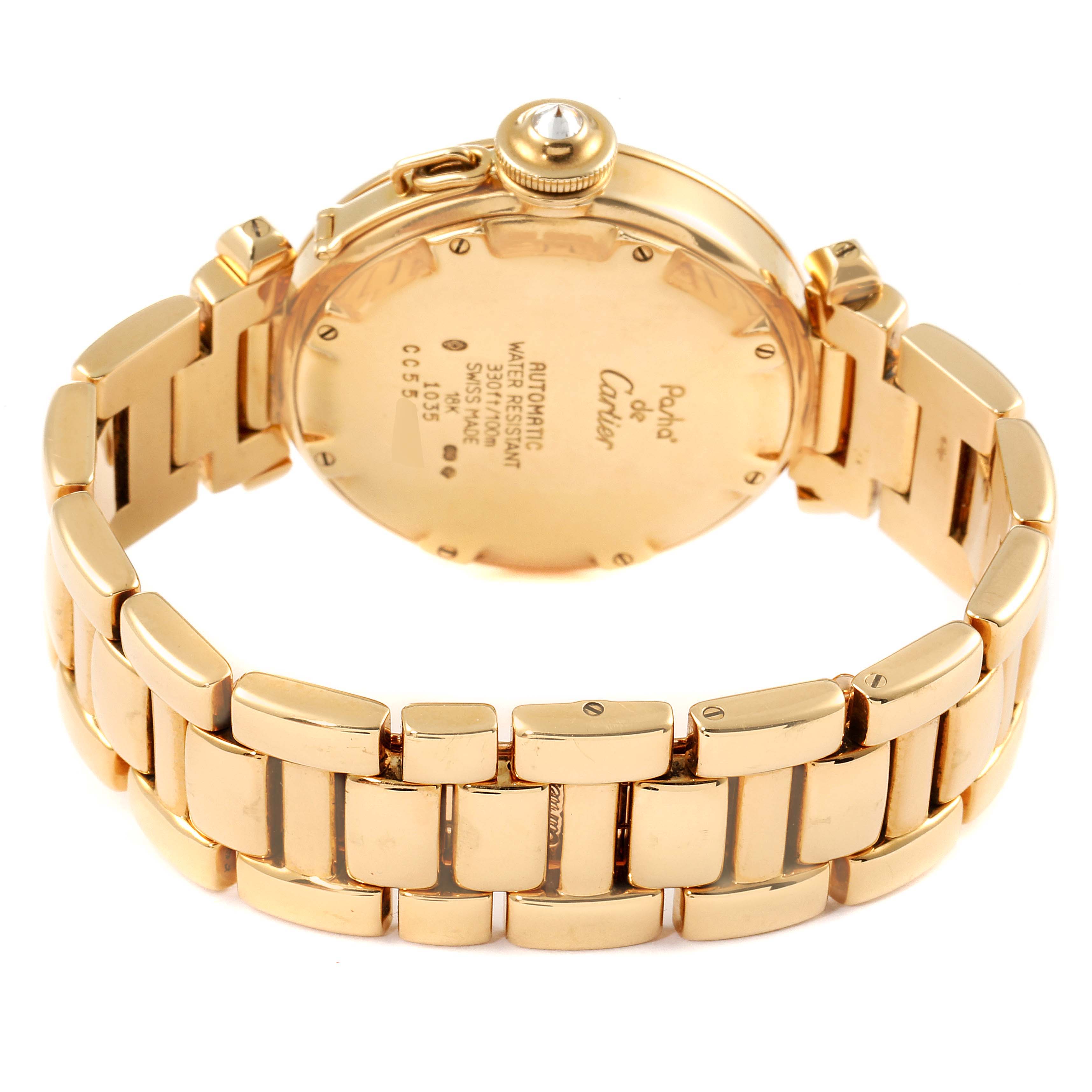 This image shows the back view of a Cartier Pasha WJ1110H9 Women's Yellow Gold Silver Dial WJ1110H9 Women's Yellow Gold Silver Dial watch, highlighting its gold bracelet and case back.