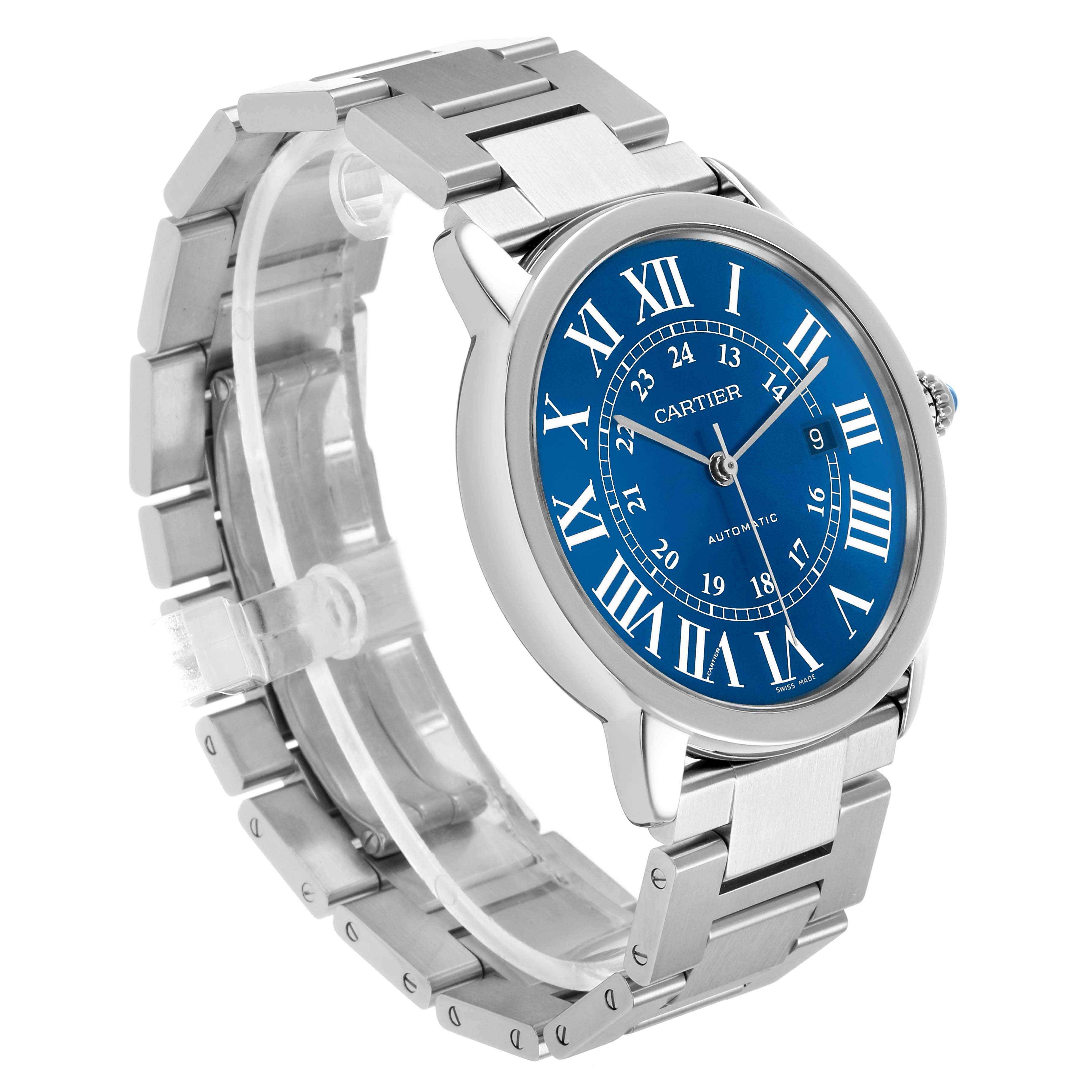 The Cartier Ronde WSRN0023 Men's Stainless Steel Blue Dial watch is shown at a three-quarter angle, highlighting the blue face, Roman numerals, and stainless steel bracelet.