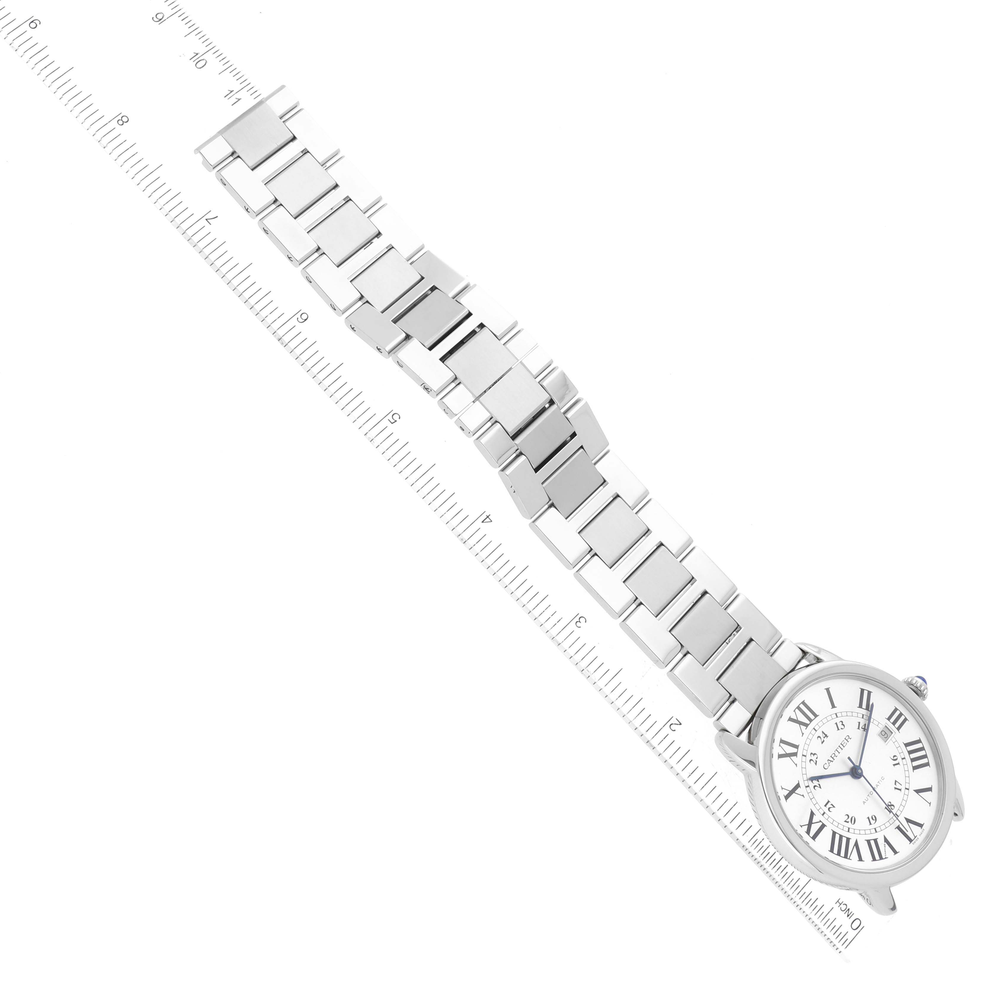 The image shows the Cartier Ronde W6701011 Men
s Stainless Steel Silver Dial W6701011 Men
s Stainless Steel Silver Dial watch laid flat with its bracelet and face visible, aligned with a ruler for scale.