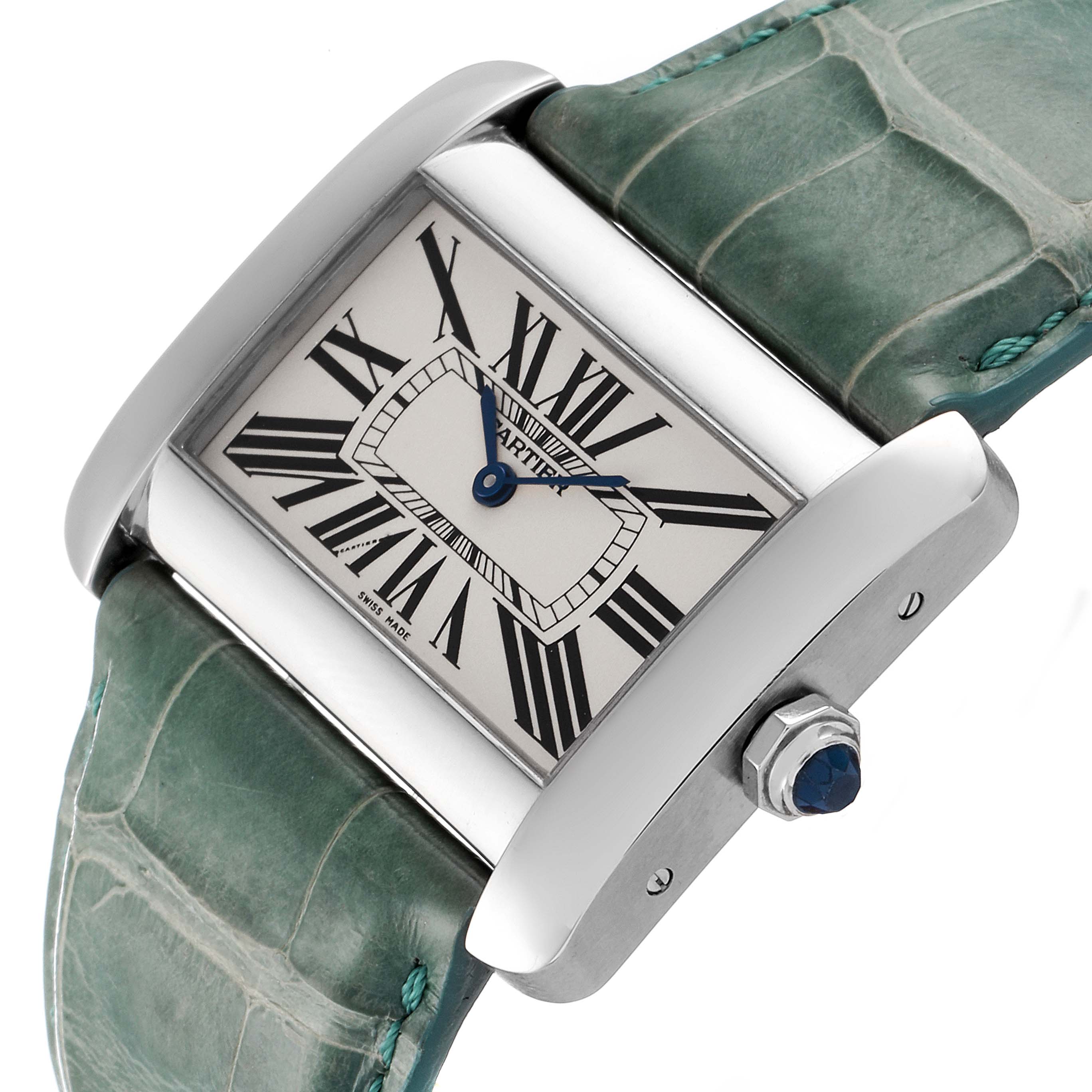 The Tank Divan by Cartier is shown at an angled close-up, highlighting the case, dial, and part of the strap.