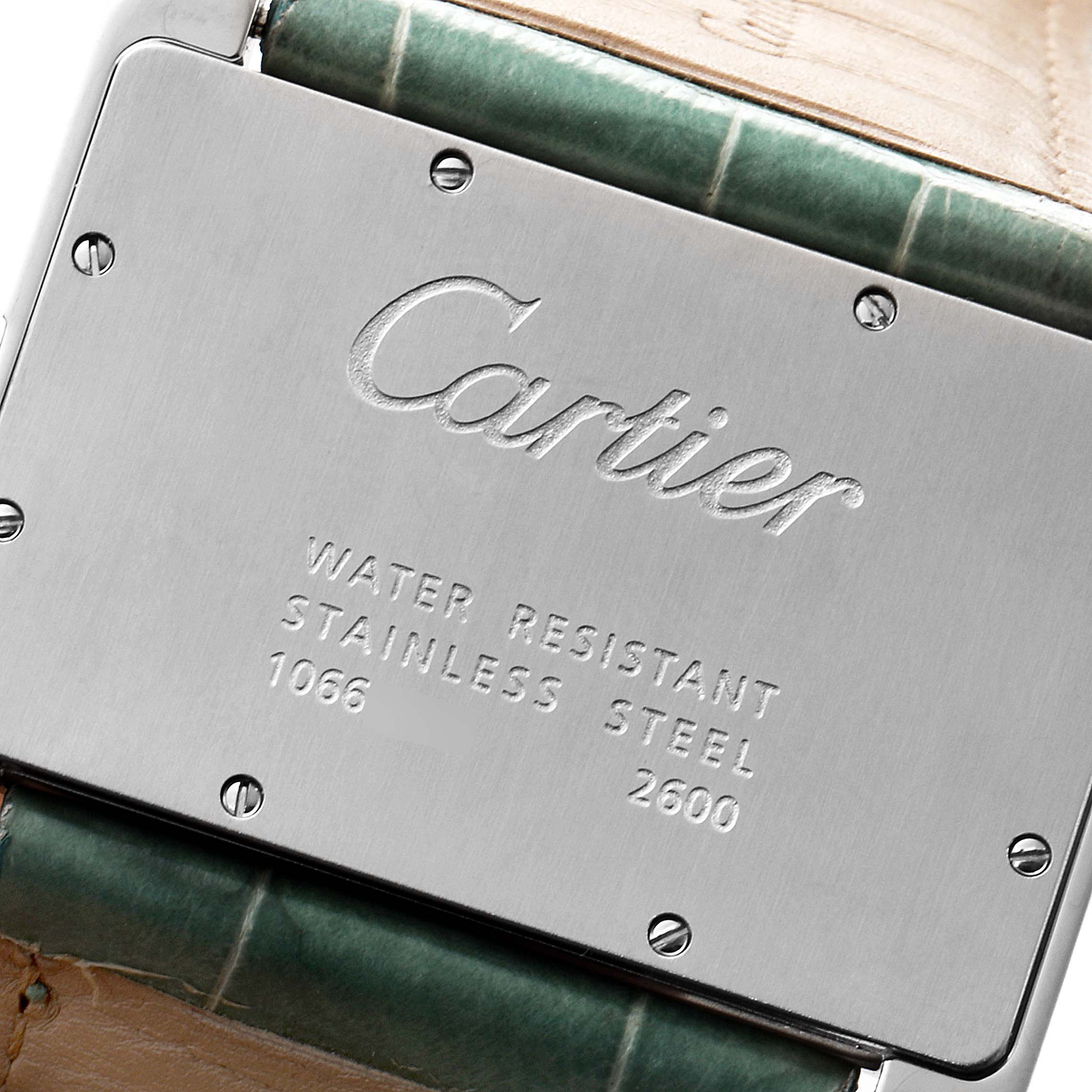 This image shows the back casing of a Cartier Tank Divan W6300755 Men
s Stainless Steel Silver Dial W6300755 Men
s Stainless Steel Silver Dial watch, highlighting the stainless steel and water resistance markings.
