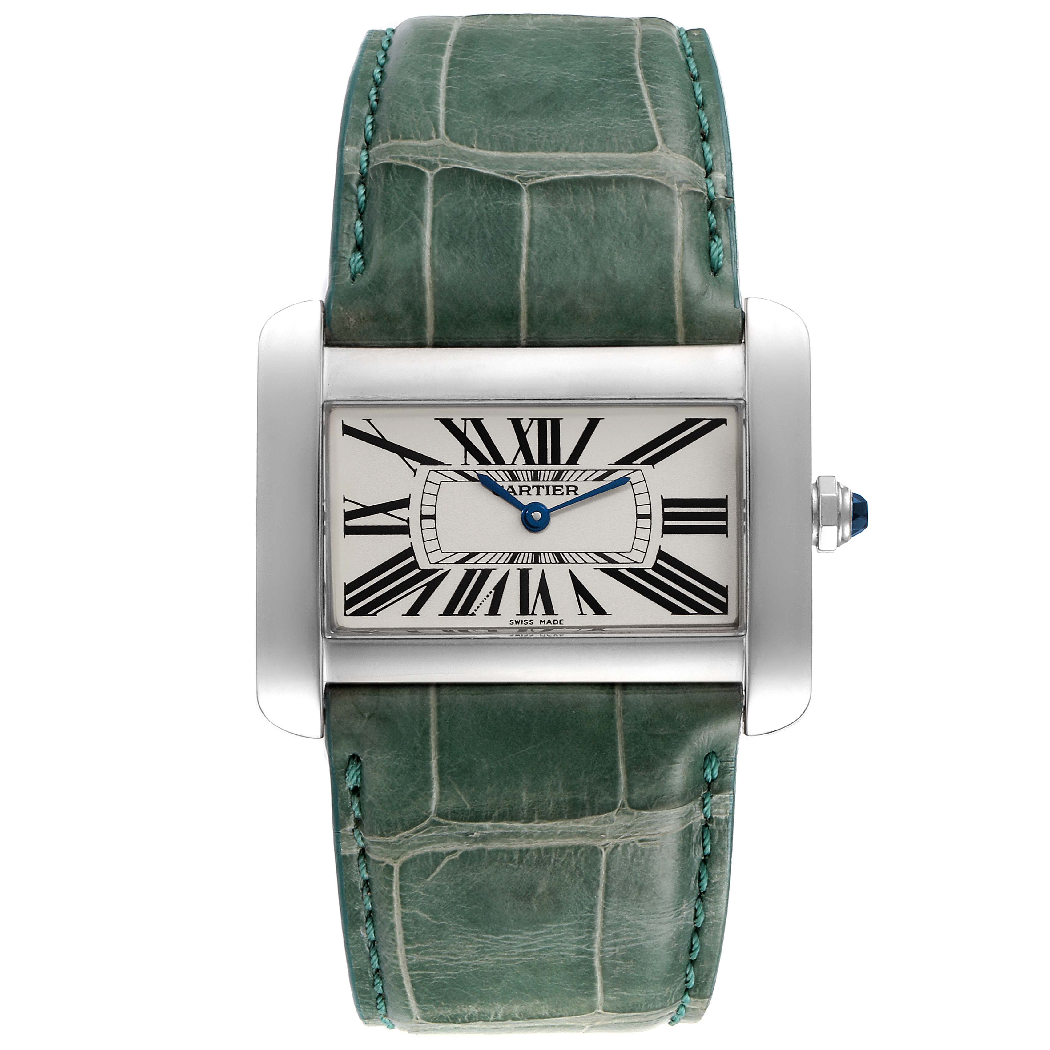 The image shows a front view of a Cartier Tank Divan W6300755 Men
s Stainless Steel Silver Dial W6300755 Men
s Stainless Steel Silver Dial watch with a green leather strap and a white dial with Roman numerals.