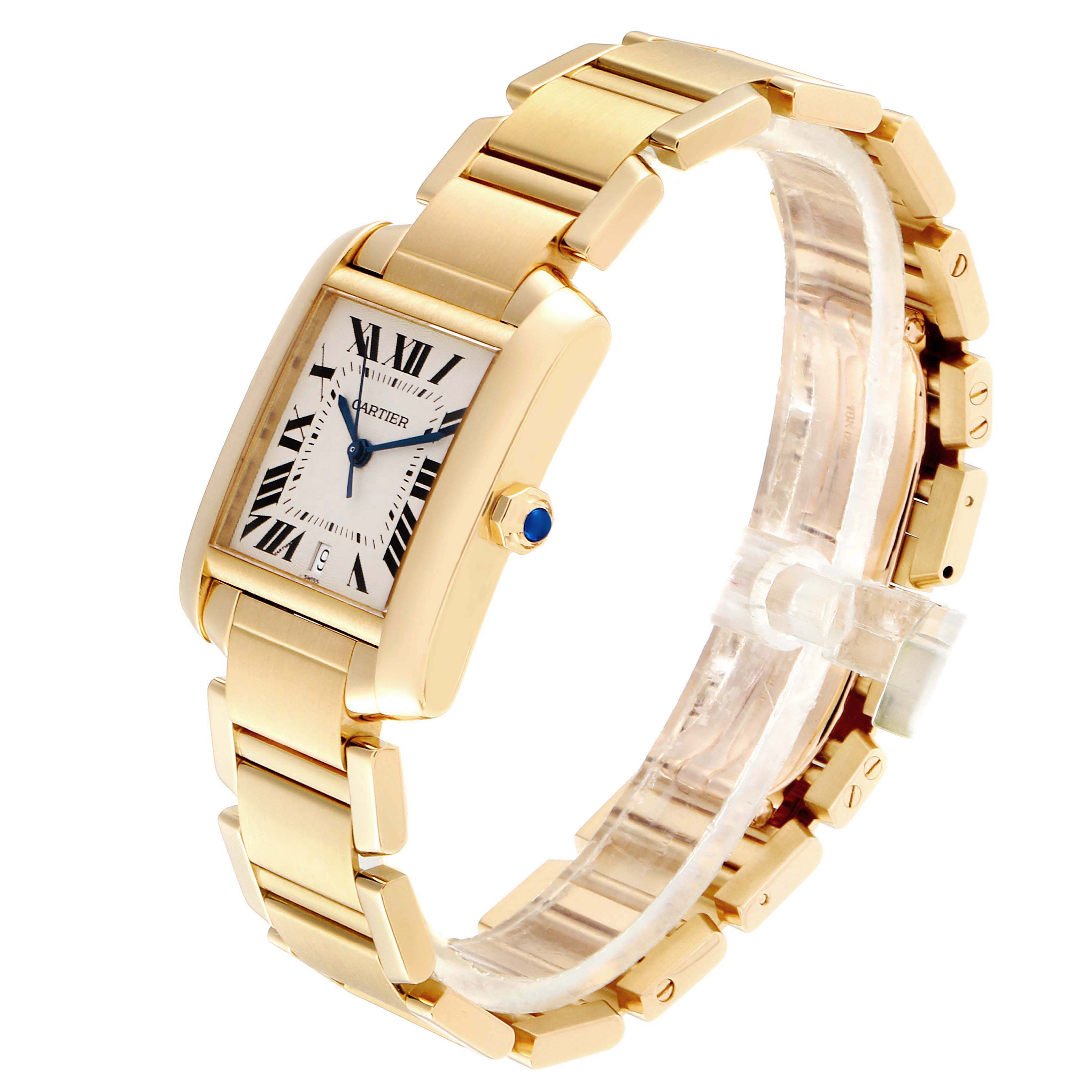 The image shows a Cartier Tank Francaise W50001R2 Men's Yellow Gold Silver Dial W50001R2 Men's Yellow Gold Silver Dial watch at an angle highlighting its rectangular face, gold bracelet, and sapphire crown.