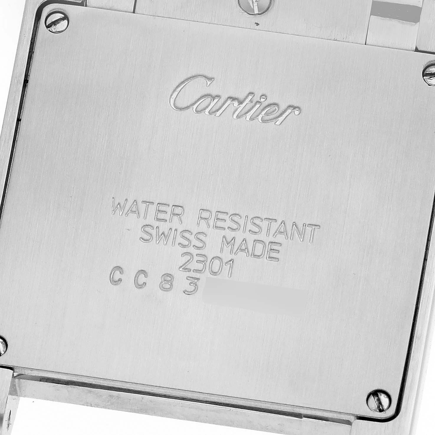 This image shows the back case of a Cartier Tank Francaise WSTA0005 Women
s Stainless Steel Silver Dial WSTA0005 Women
s Stainless Steel Silver Dial watch, featuring engraved branding and specifications.