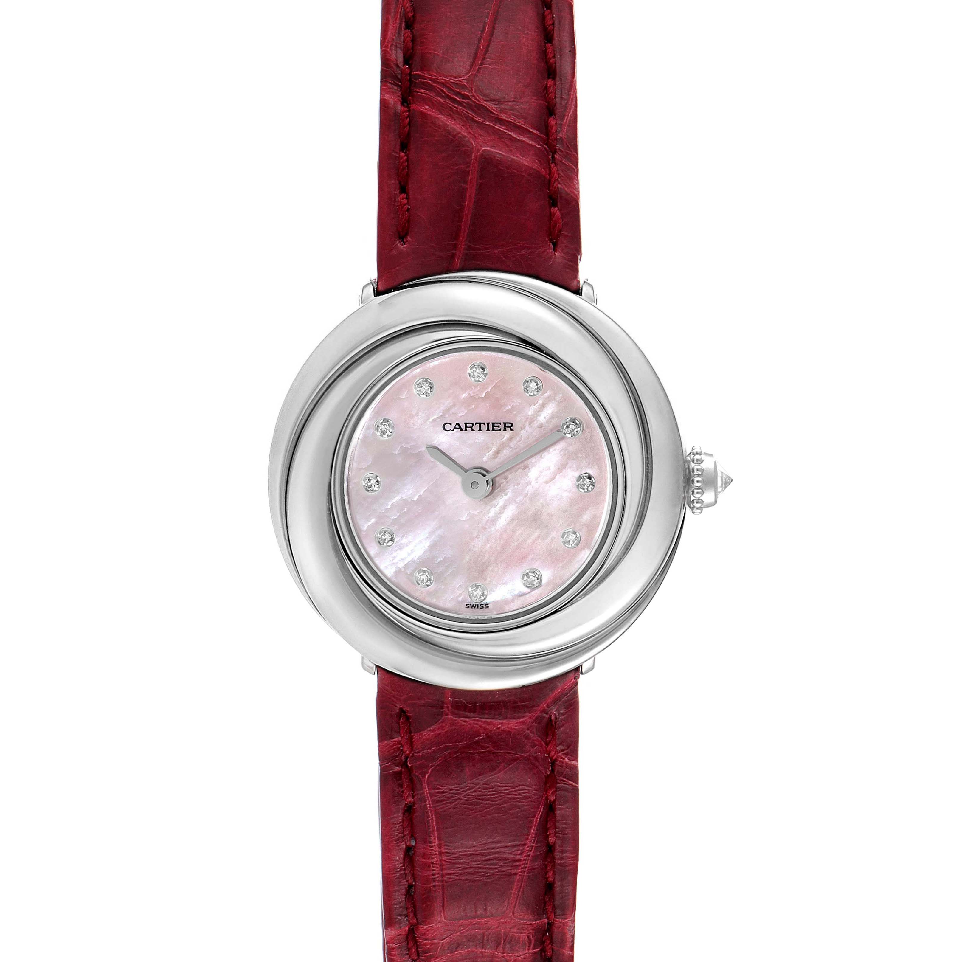The Cartier Trinity WG200846 Women's White Gold Mother of Pearl Dial watch is shown from the front, highlighting its pink dial, silver casing, and red leather strap.