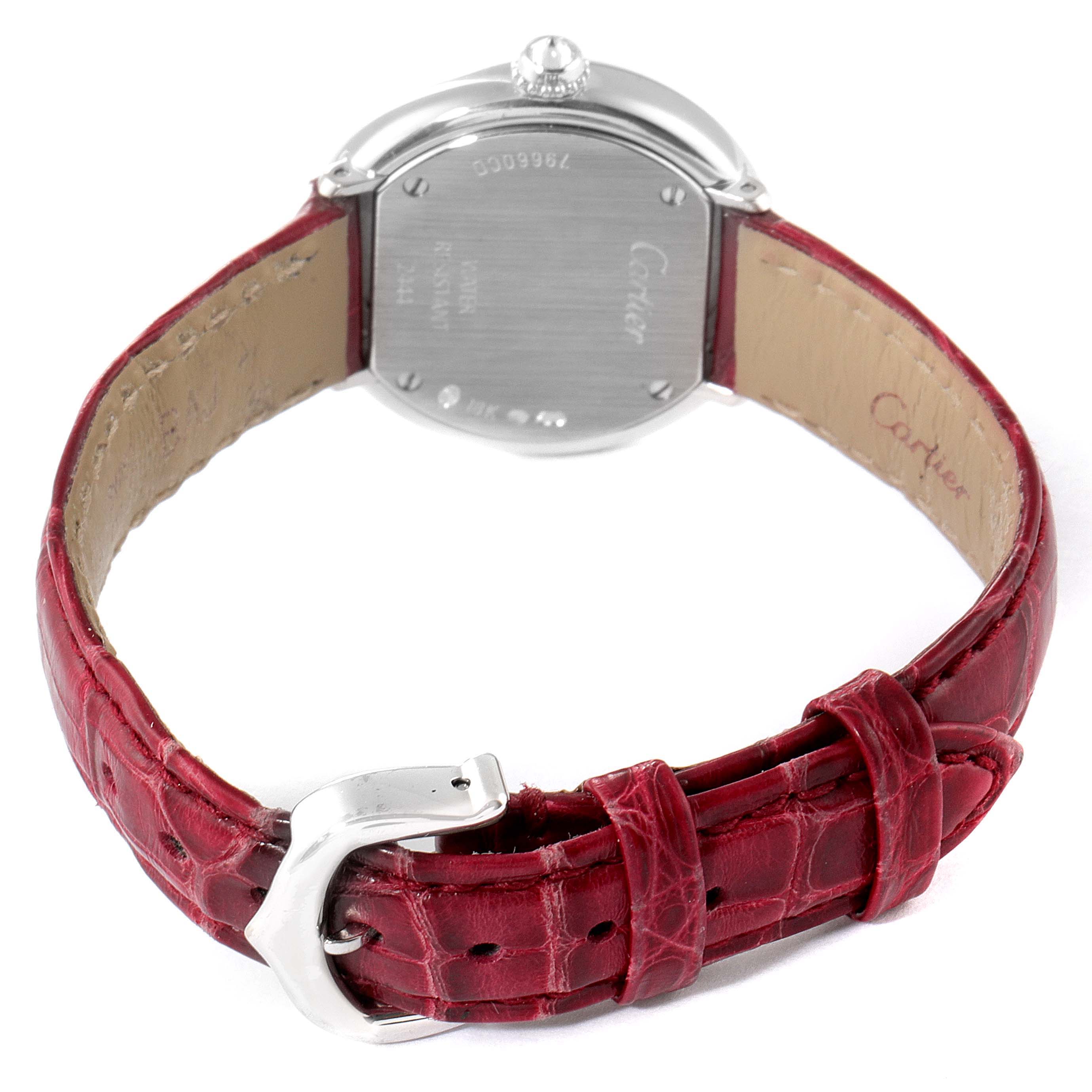 The image shows the back view of a Cartier Trinity WG200846 Women's White Gold Mother of Pearl Dial watch, highlighting the case back, crown, and red leather strap with buckle.