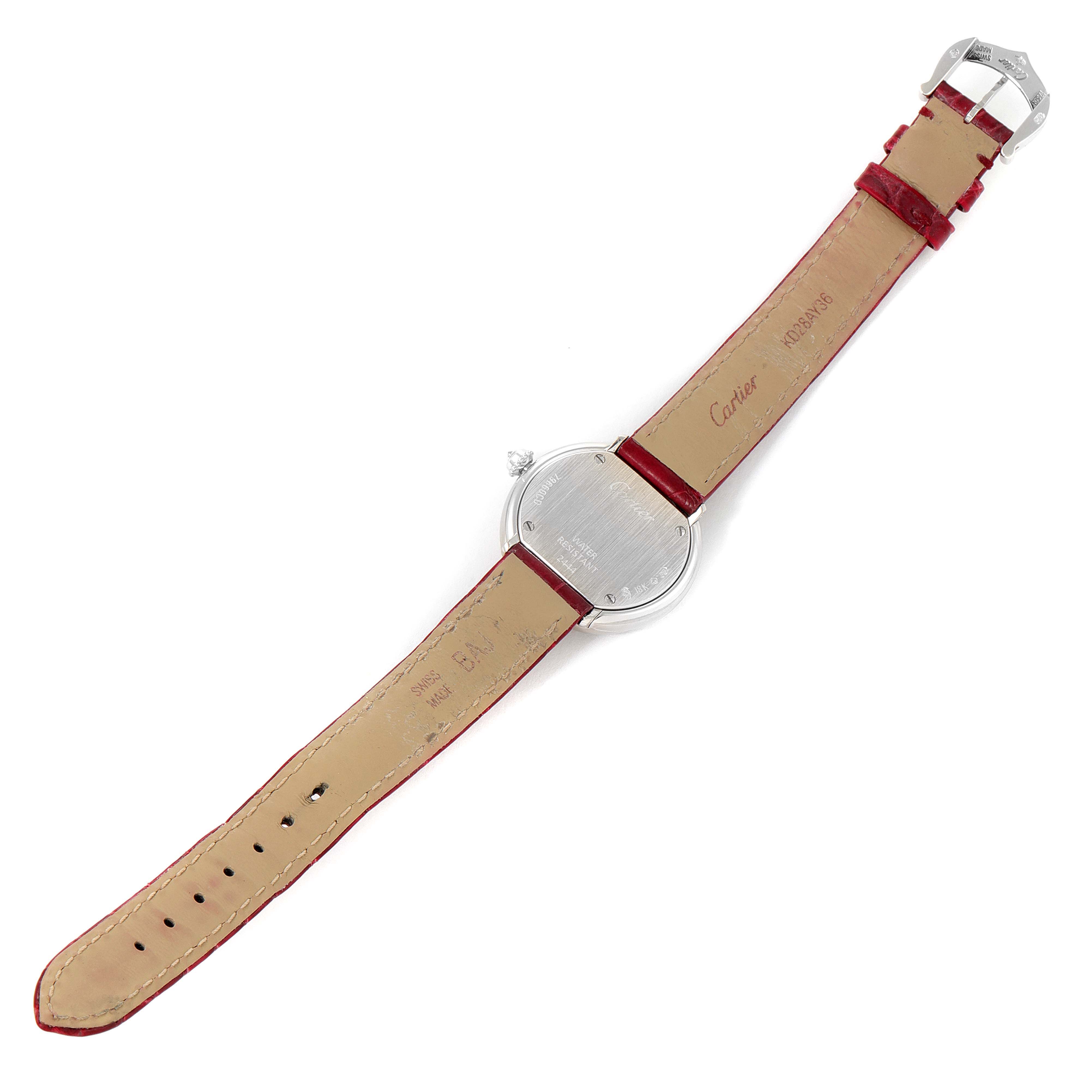 The Cartier Trinity WG200846 Women's White Gold Mother of Pearl Dial watch is shown from the back, displaying the case back and red leather strap.
