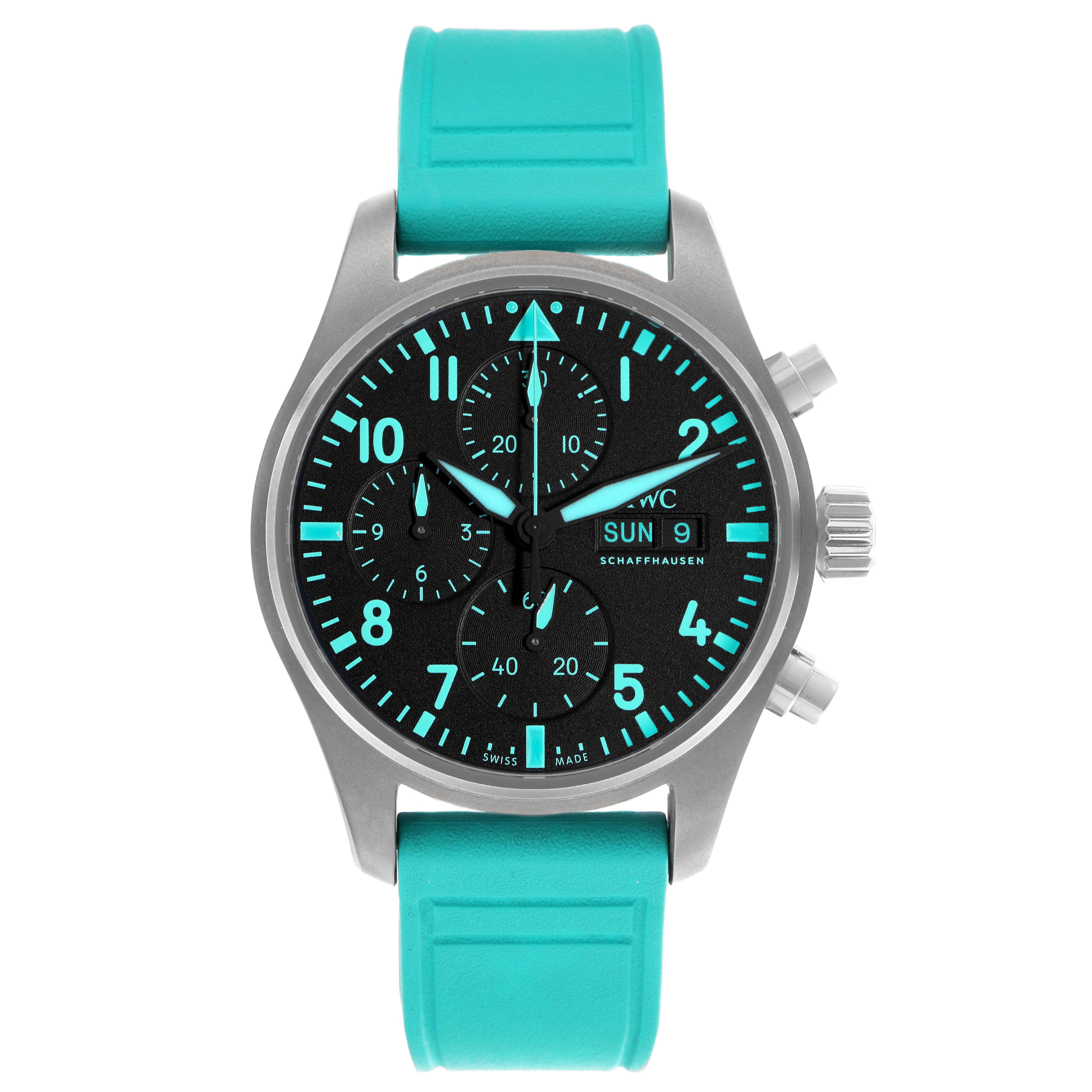 The IWC Pilot IW388108 Men's Titanium Black Dial model watch is shown from a front angle, displaying its face, case, and blue strap.
