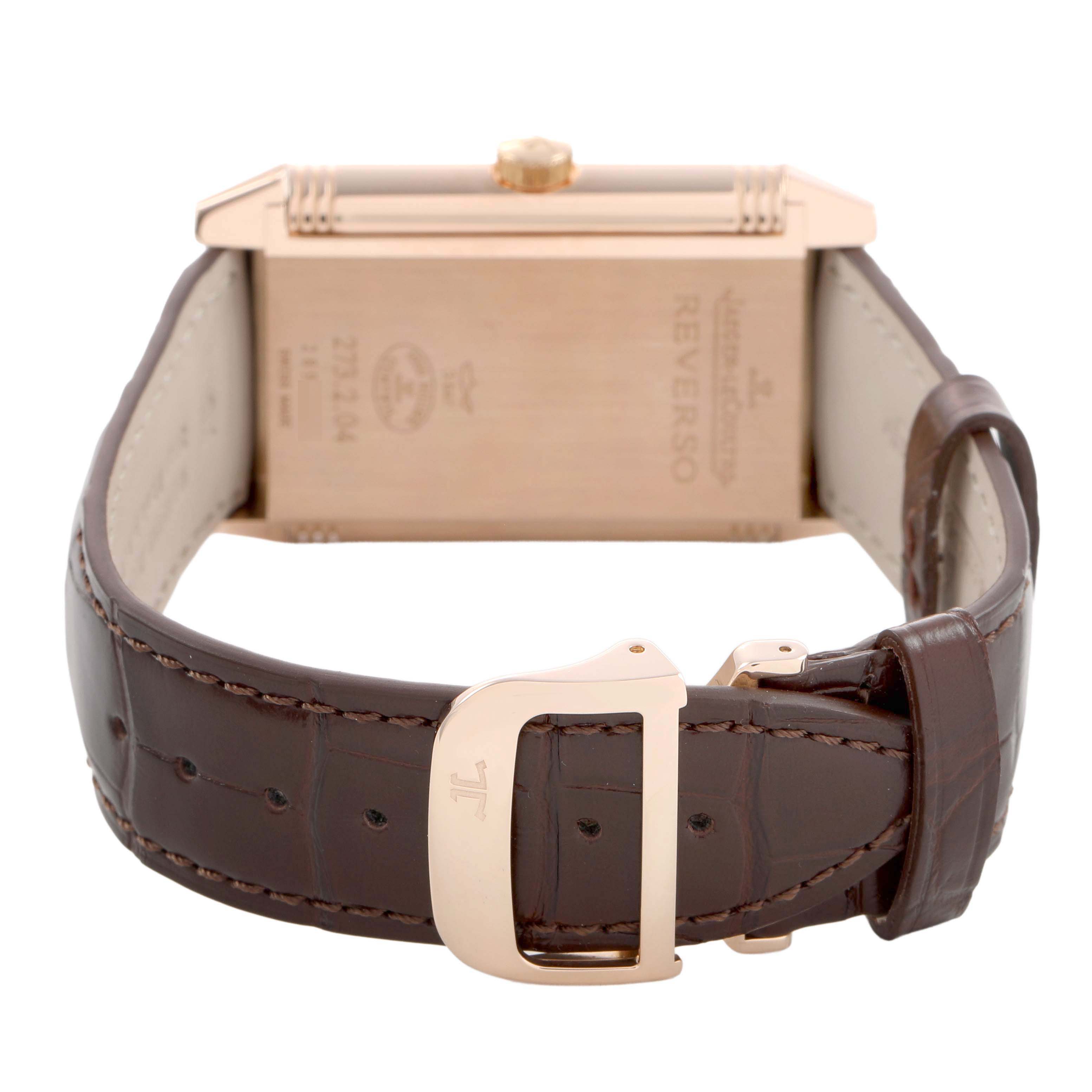 The image shows the back of a Jaeger LeCoultre Reverso Q3732420 Men's Rose Gold Silver Dial watch, highlighting the back casing and the leather strap with the buckle.