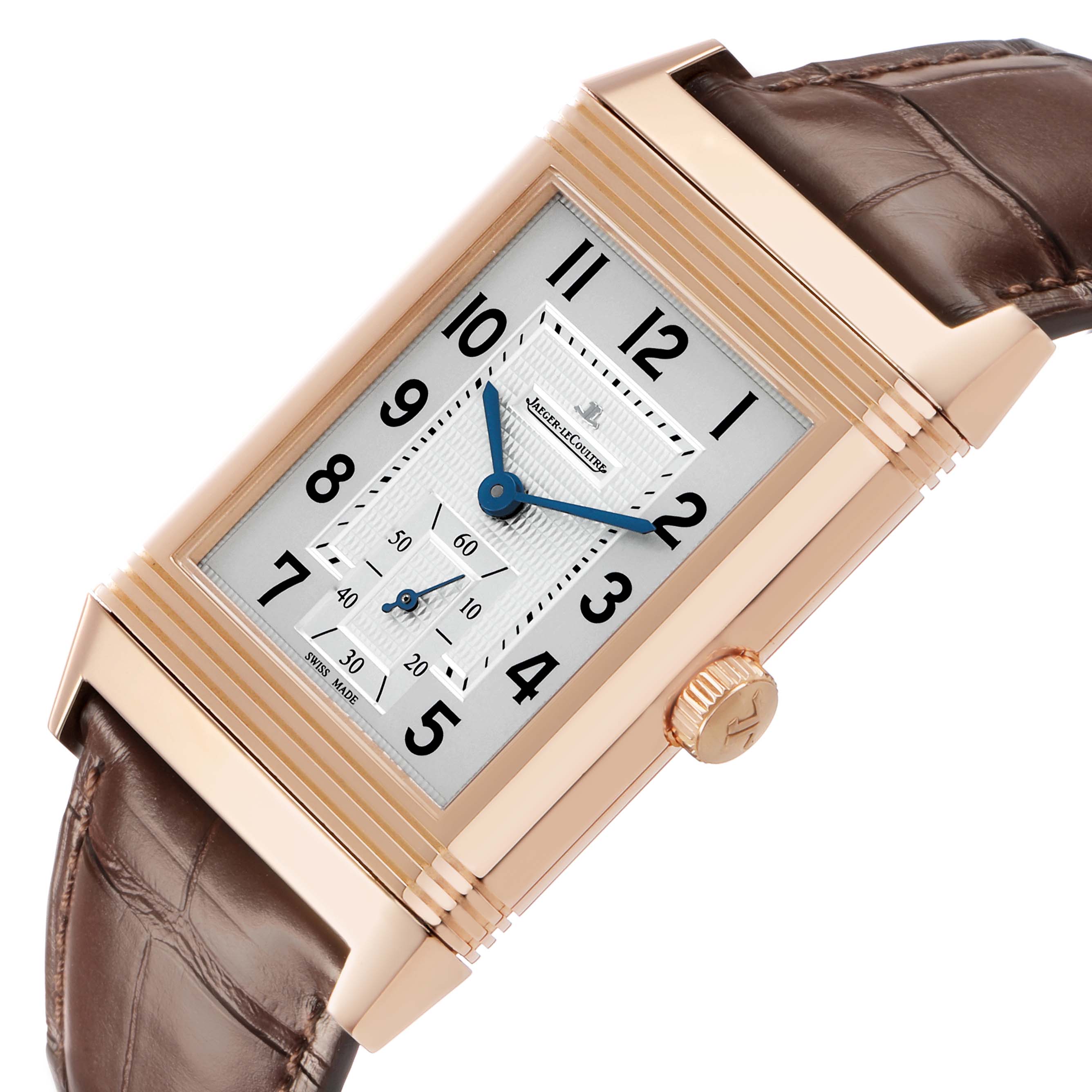 The image shows a Jaeger-LeCoultre Reverso watch at a slight angle, highlighting its rectangular case, dial, and crown.