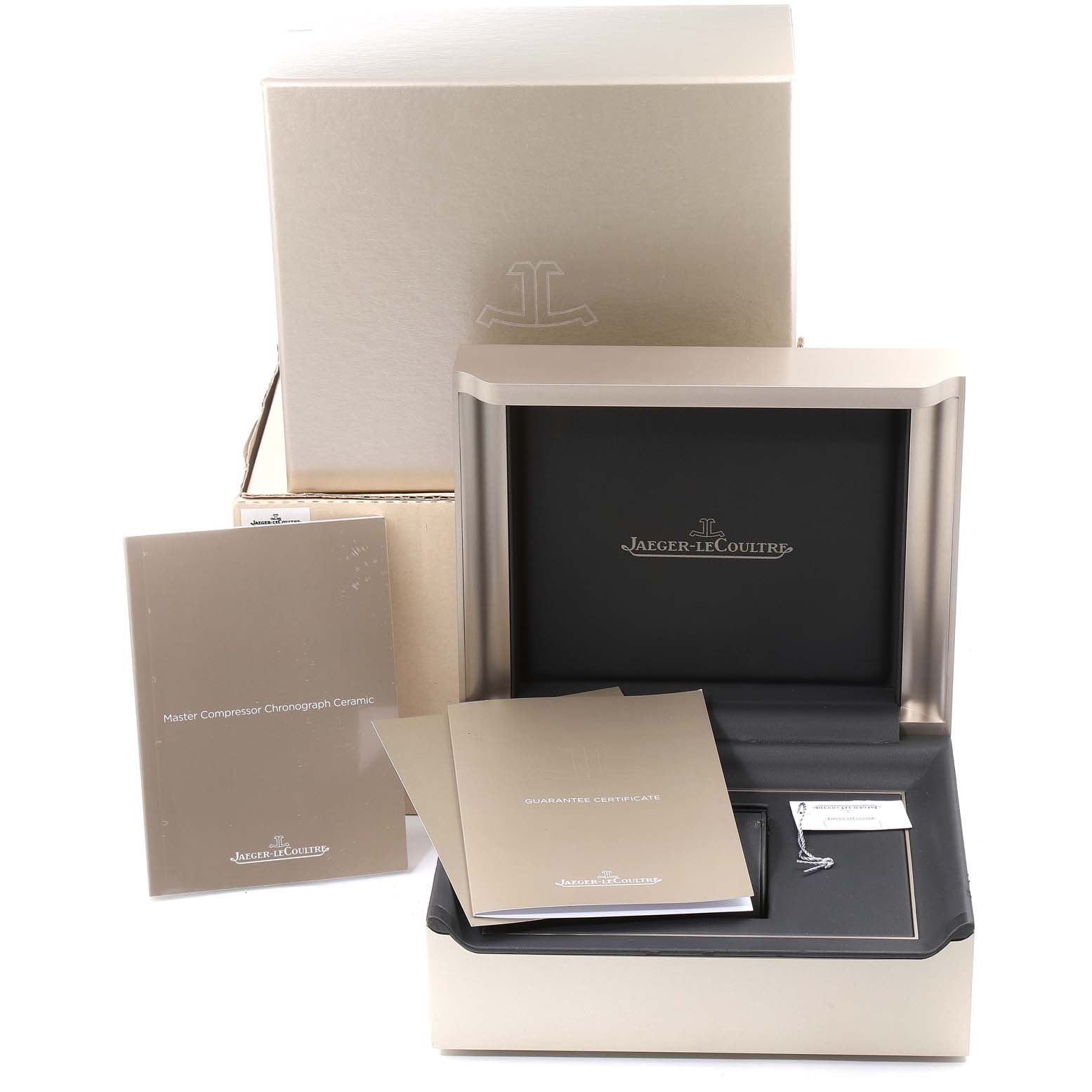 This image shows the packaging and documentation for a Jaeger LeCoultre Master Q205C571 Men's Ceramic Grey Dial Q205C571 Men's Ceramic Grey Dial model watch, including the box, manuals, and certificate.