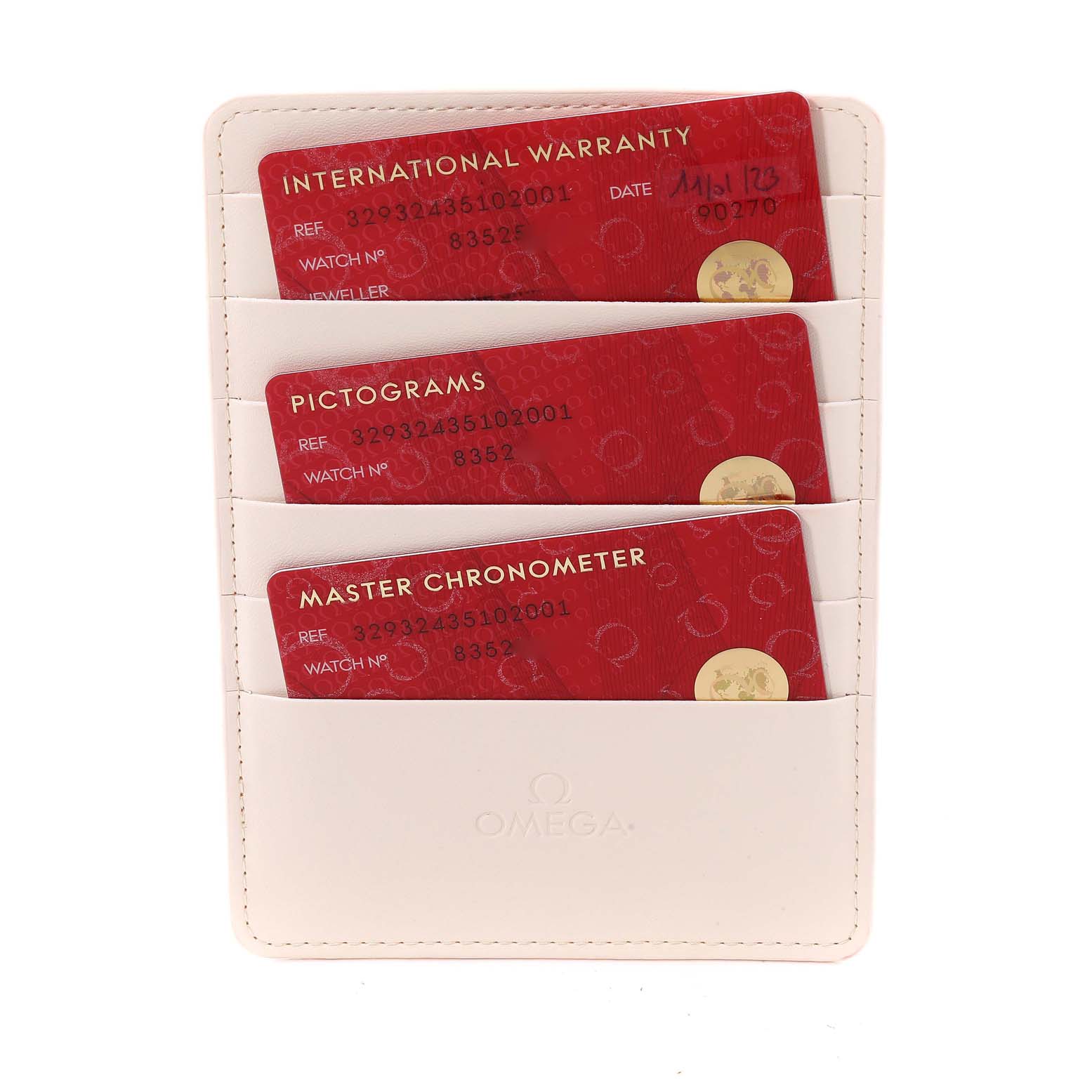 The image shows the Omega Speedmaster 329.32.43.51.02.001 Men
s Stainless Steel Silver Dial 329.32.43.51.02.001 Men
s Stainless Steel Silver Dial cards for international warranty, pictograms, and master chronometer in a white card holder.