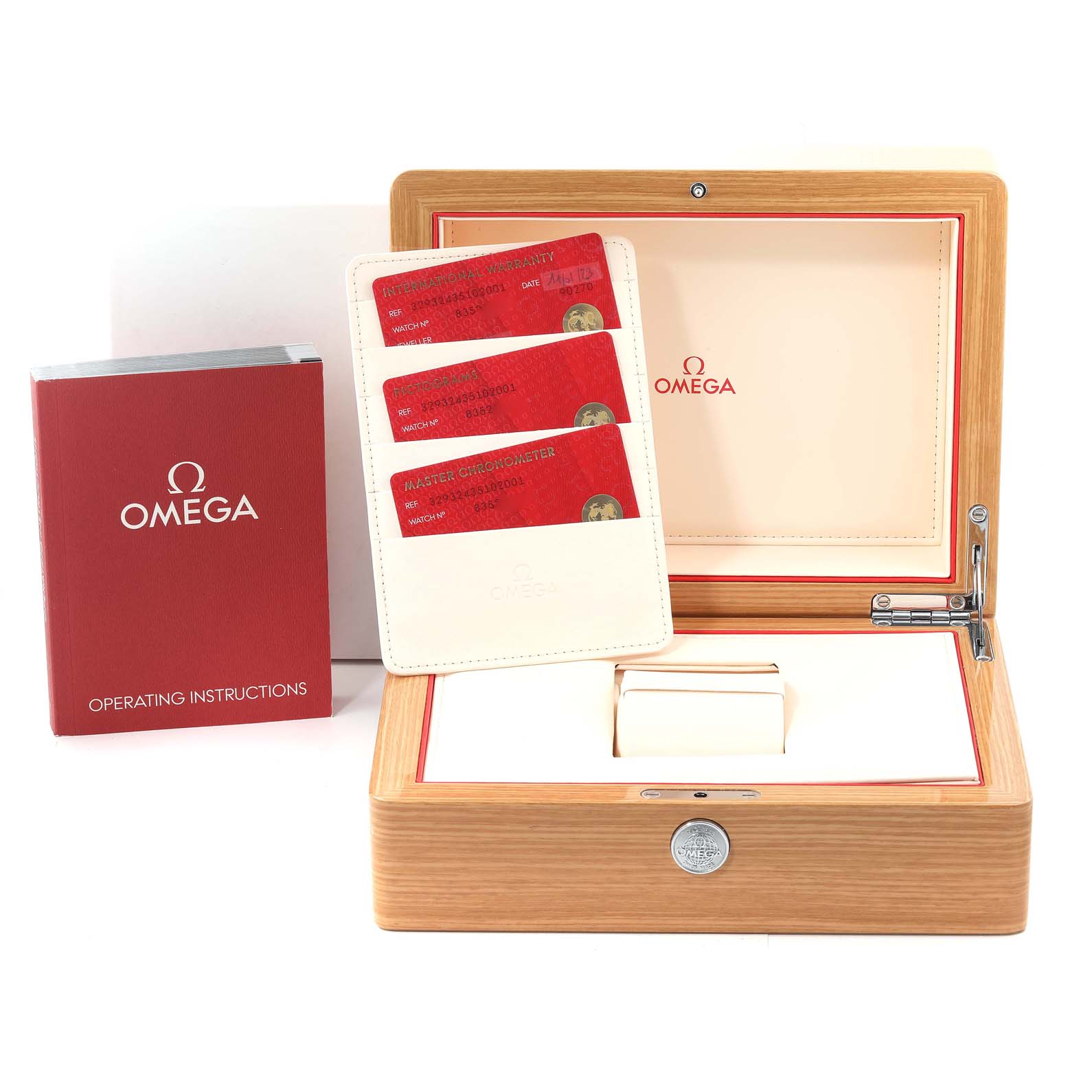 This image shows the Omega Speedmaster 329.32.43.51.02.001 Men
s Stainless Steel Silver Dial 329.32.43.51.02.001 Men
s Stainless Steel Silver Dial watch box, operating instructions, and warranty cards arranged neatly.