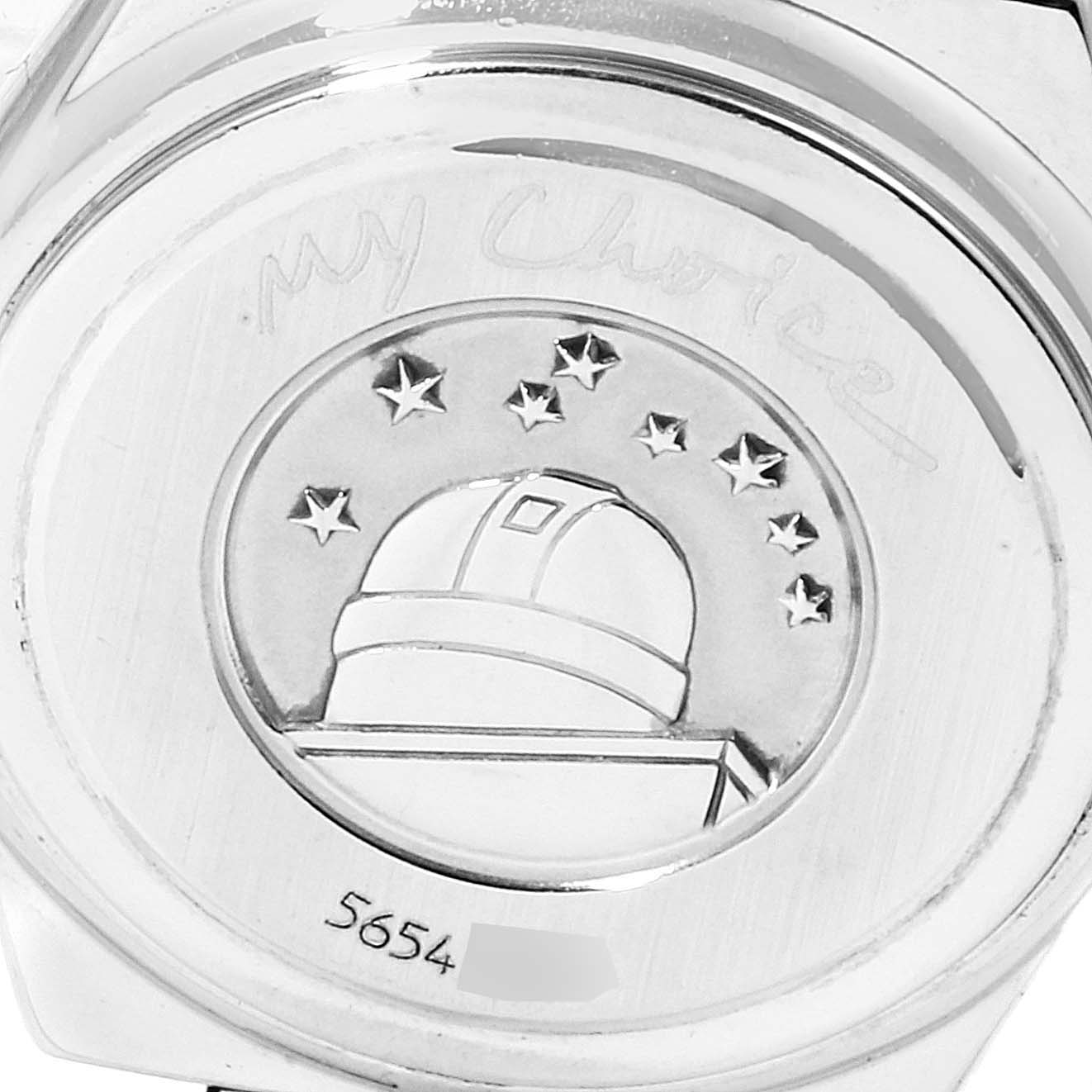 The image shows the case back of the Omega 1465.71.00 Women
s Stainless Steel Mother of Pearl Dial 1465.71.00 Women
s Stainless Steel Mother of Pearl Dial Constellation My Choice Diamond Steel Ladies Watch 1465.71.00, with engravings and an observatory design.